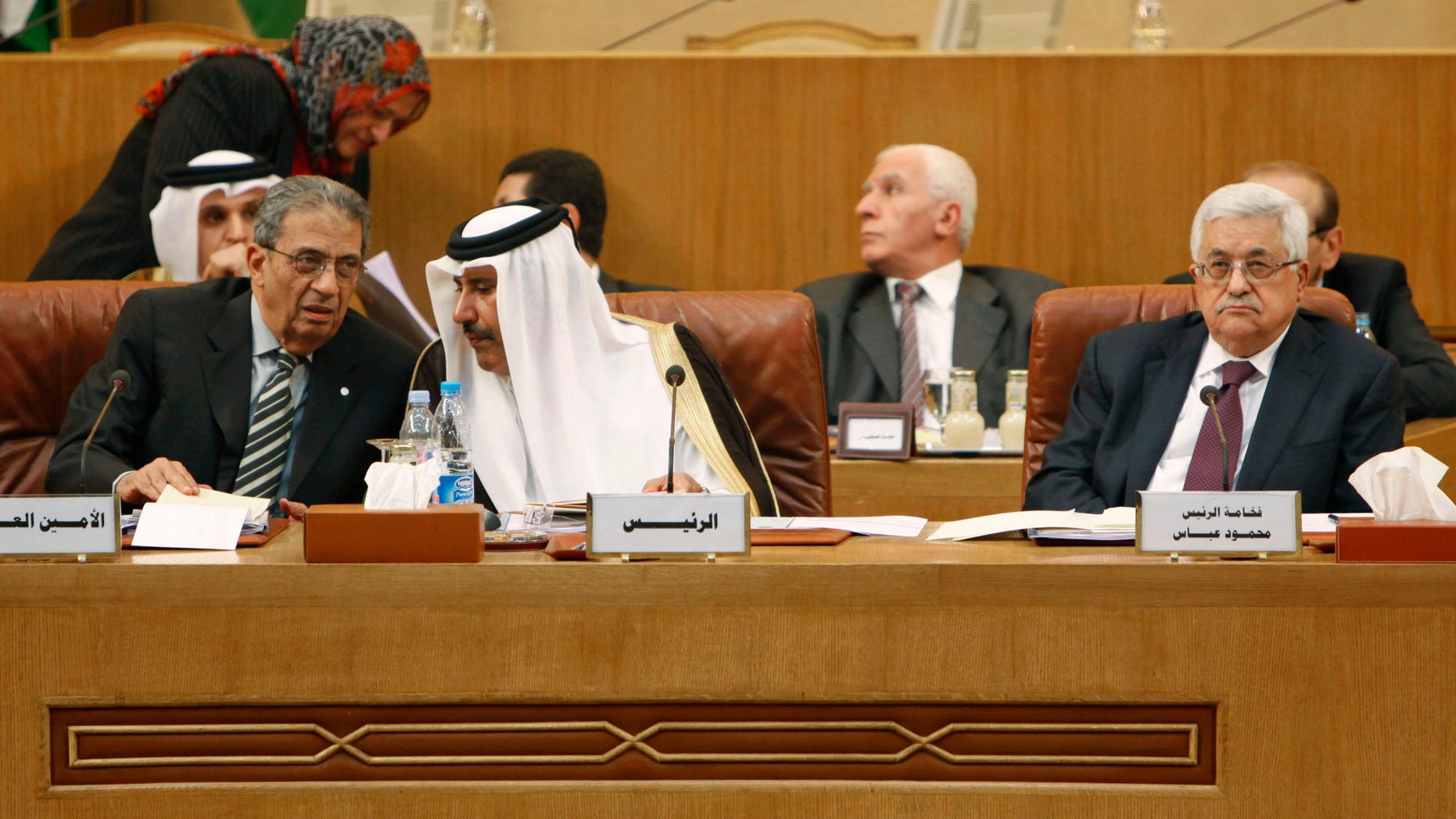 Dec. 15: Front from left, Arab League Secretary General Amr Moussa, Qatari Prime Minister Sheikh Hamad bin Jassem al-Thani and Palestinian Authority President Mahmoud Abbas at the Arab League headquarters in Cairo, Egypt. Amr Moussa says he senses that neither north nor south Sudan have any desire to return to war, ahead of a referendum that could split the country.