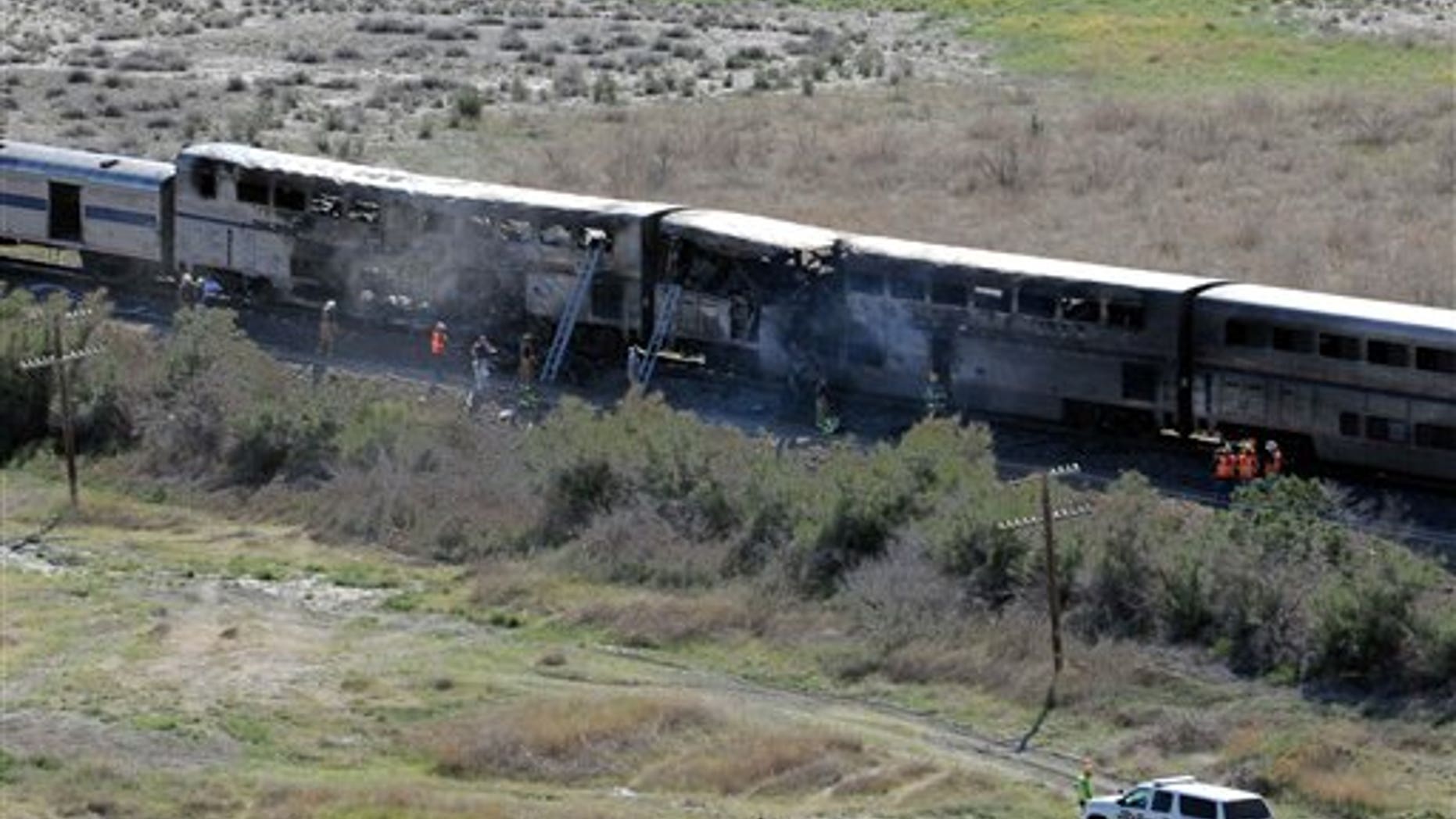 June 24. The wreckage from the collision between a semitrailer and a passenger Amtrak train in Nevada. Two people died and another 20 injured in the fiery blaze.