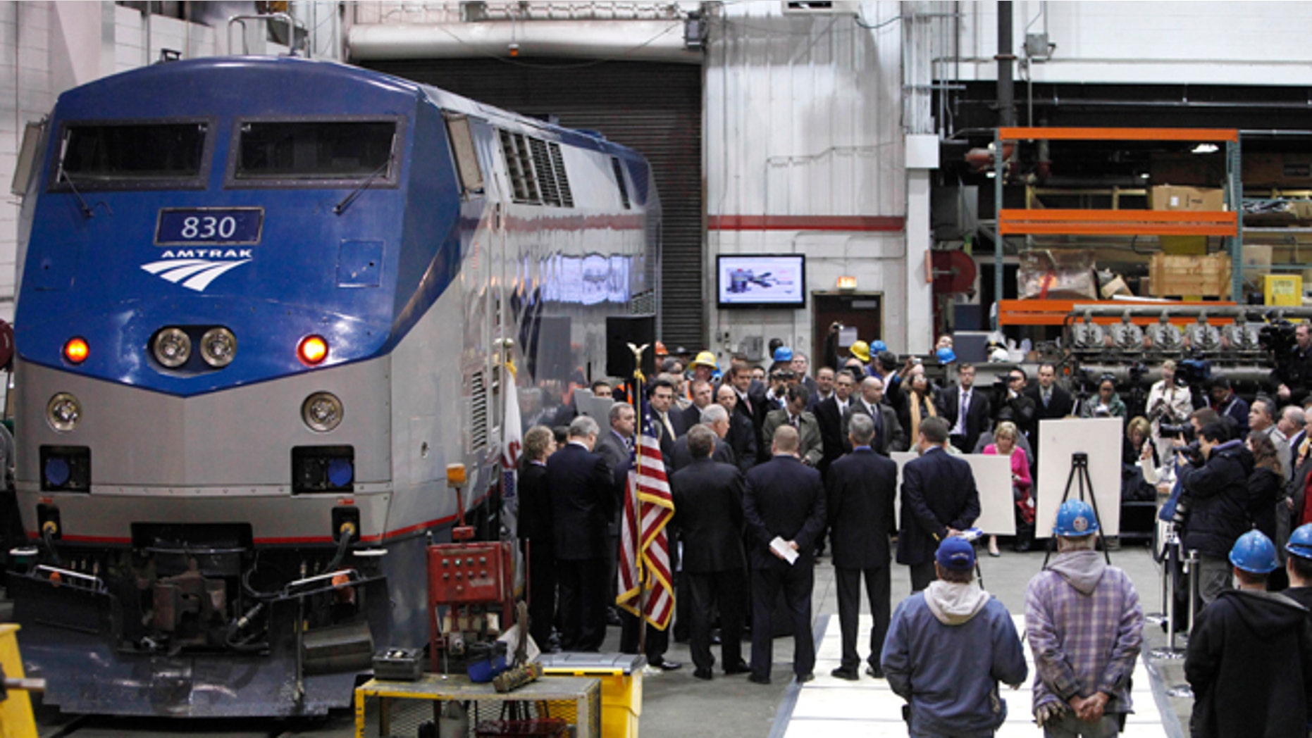 March 22, 2011: In this file photo, Illinois Gov. Pat Quinn and U.S. Sen. Dick Durbin are joined by state and local officials as they announce the next phase of high-speed rail construction during a news conference at an Amtrak maintenance building in Chicago.