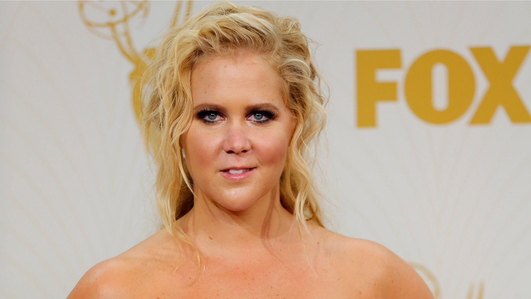 Amy Schumer posing at an event.