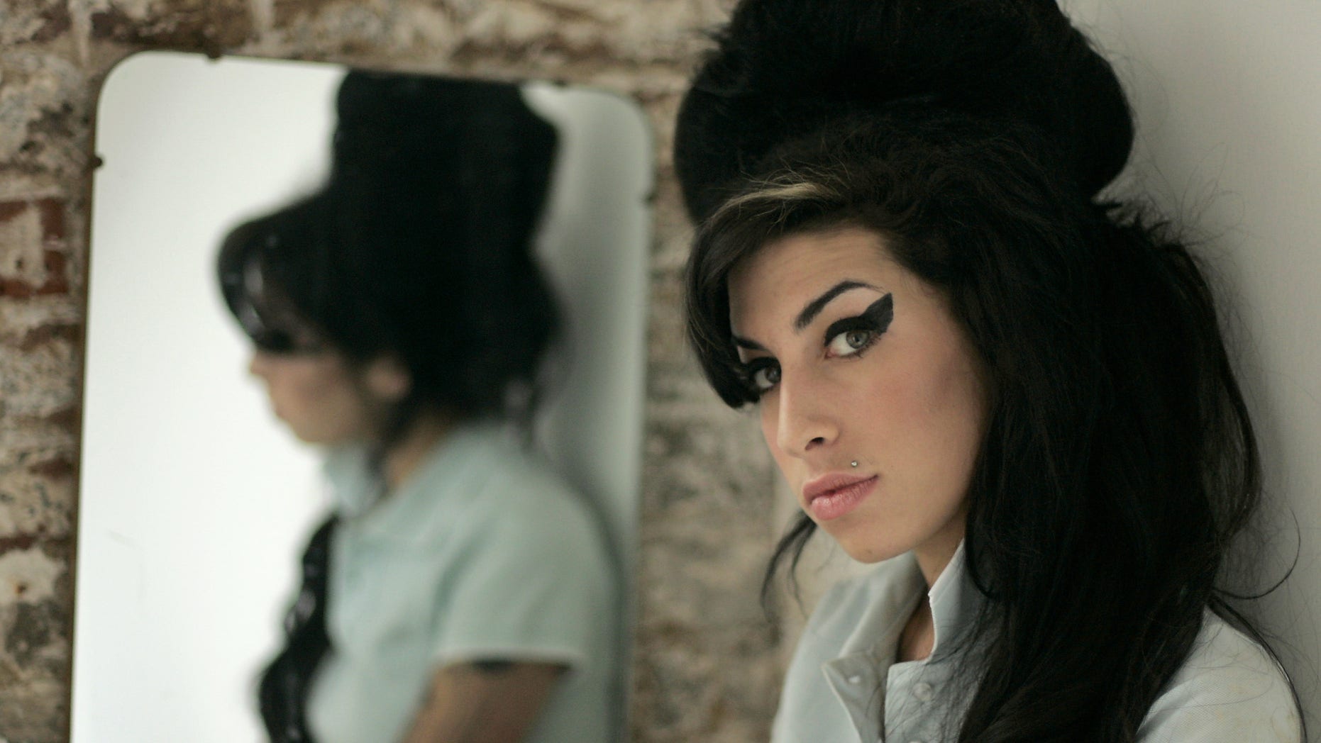 Feb. 16, 2007. British singer Amy Winehouse poses for photographs after being interviewed by The Associated Press at a studio in north London.