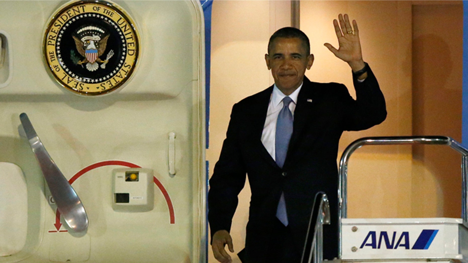 April 23: President Obama steps out from Air Force One as he arrives at Haneda International Airport in Tokyo.