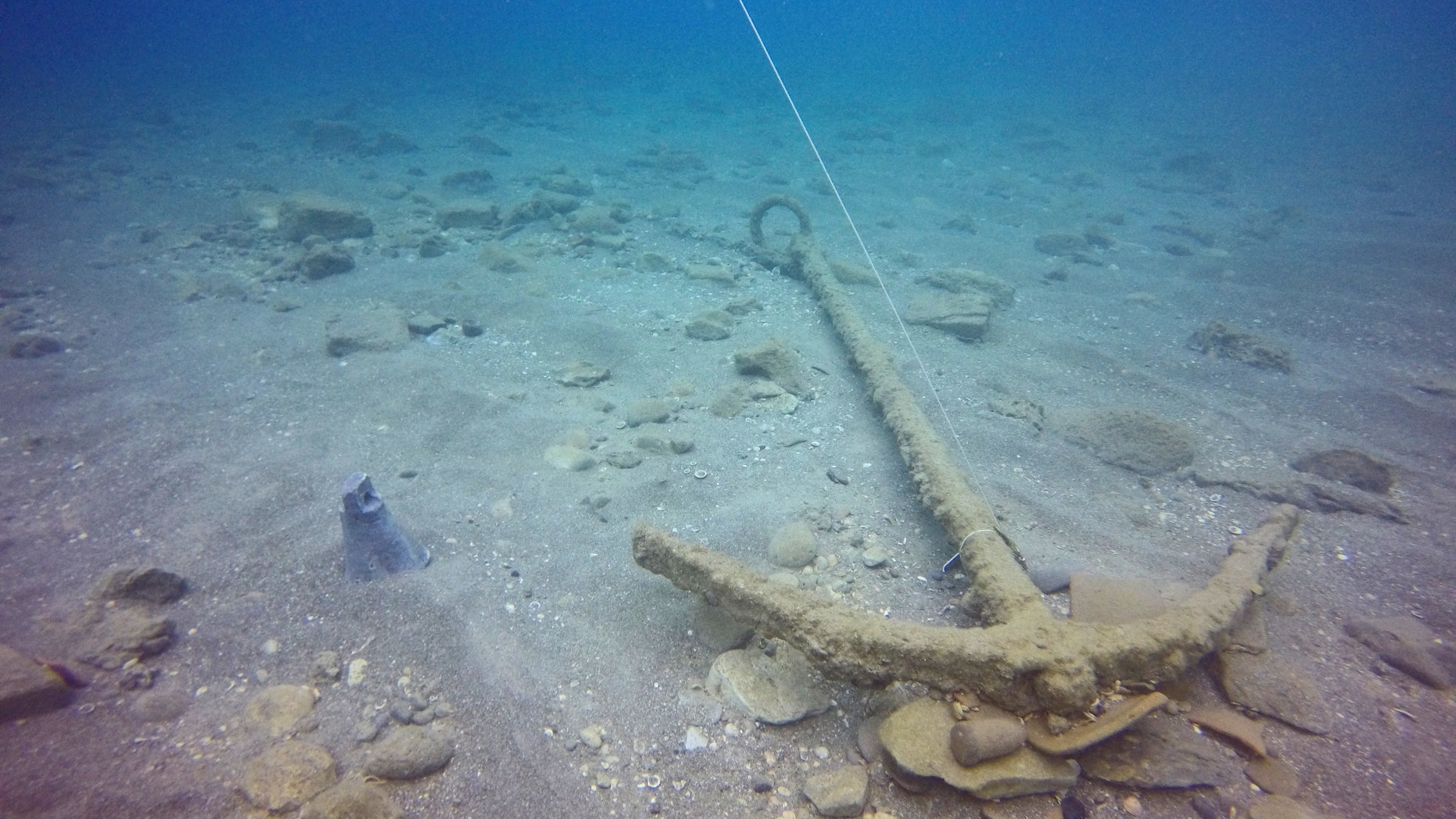 The ship’s anchor as it was discovered in the sea. (The Marine Archaeology Unit of the Israel Antiquities Authority)