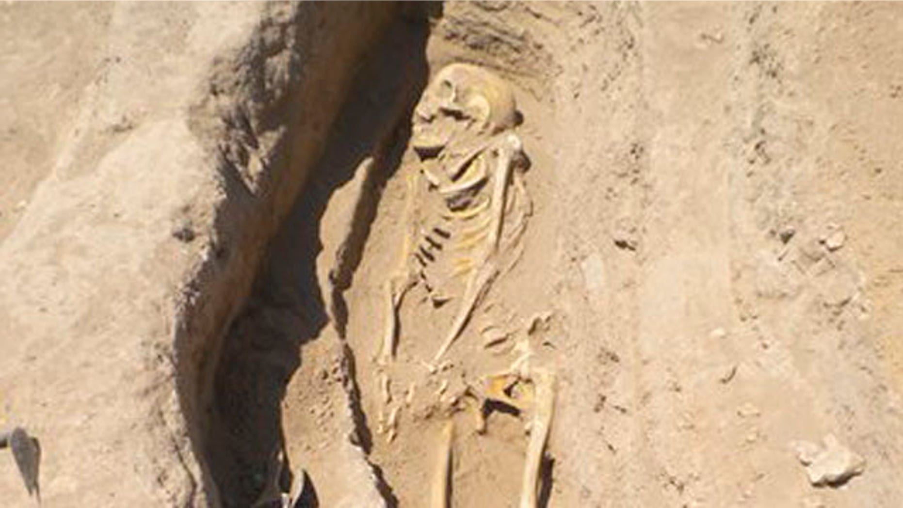 June 19, 2014: A skeleton in a grave in northern Syria in 2010.