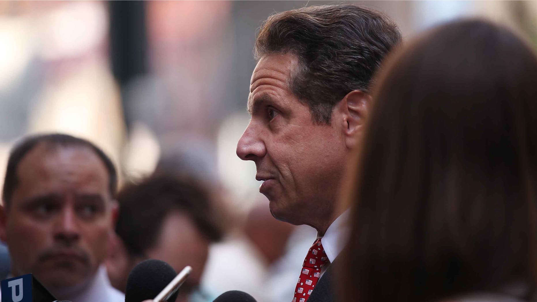 NEW YORK, NY - JULY 22: Governor Andrew M. Cuomo speaks to the media at a rally for a $15 minimum hourly wage on July 22, 2015 in New York City. A panel appointed by Cuomo recommended on Wednesday that the minimum wage be raised for employees of fast-food chain restaurants throughout the state. The panel recommended that the $15 rate be phased in by December 31, 2018 for New York City and by July 1, 2021 for the rest of the state. (Photo by Spencer Platt/Getty Images)