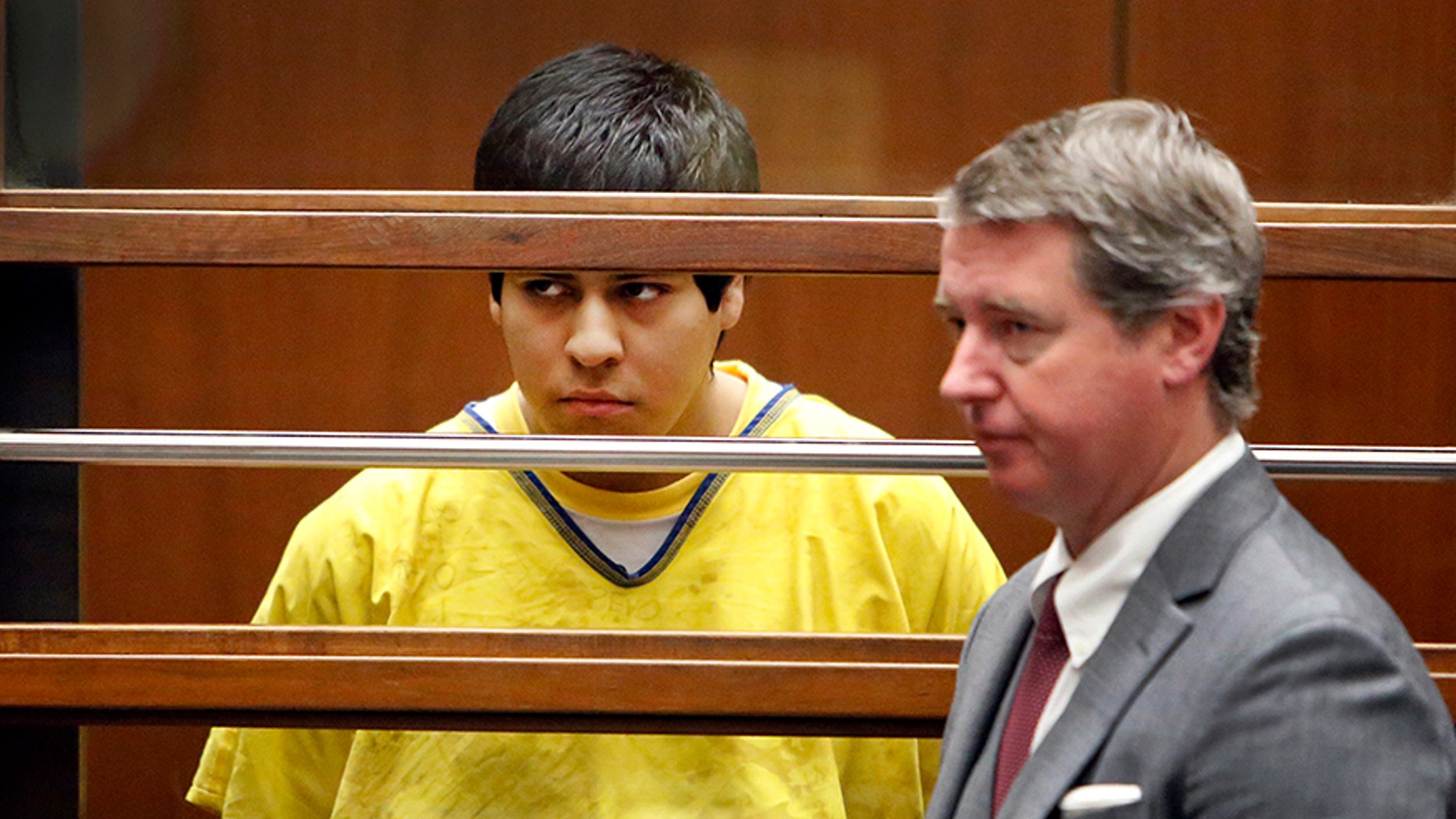 In this Jan. 12, 2015 file pool photo, Andrew Garcia, left, appears during a hearing in Los Angeles County Superior Court in Los Angeles.