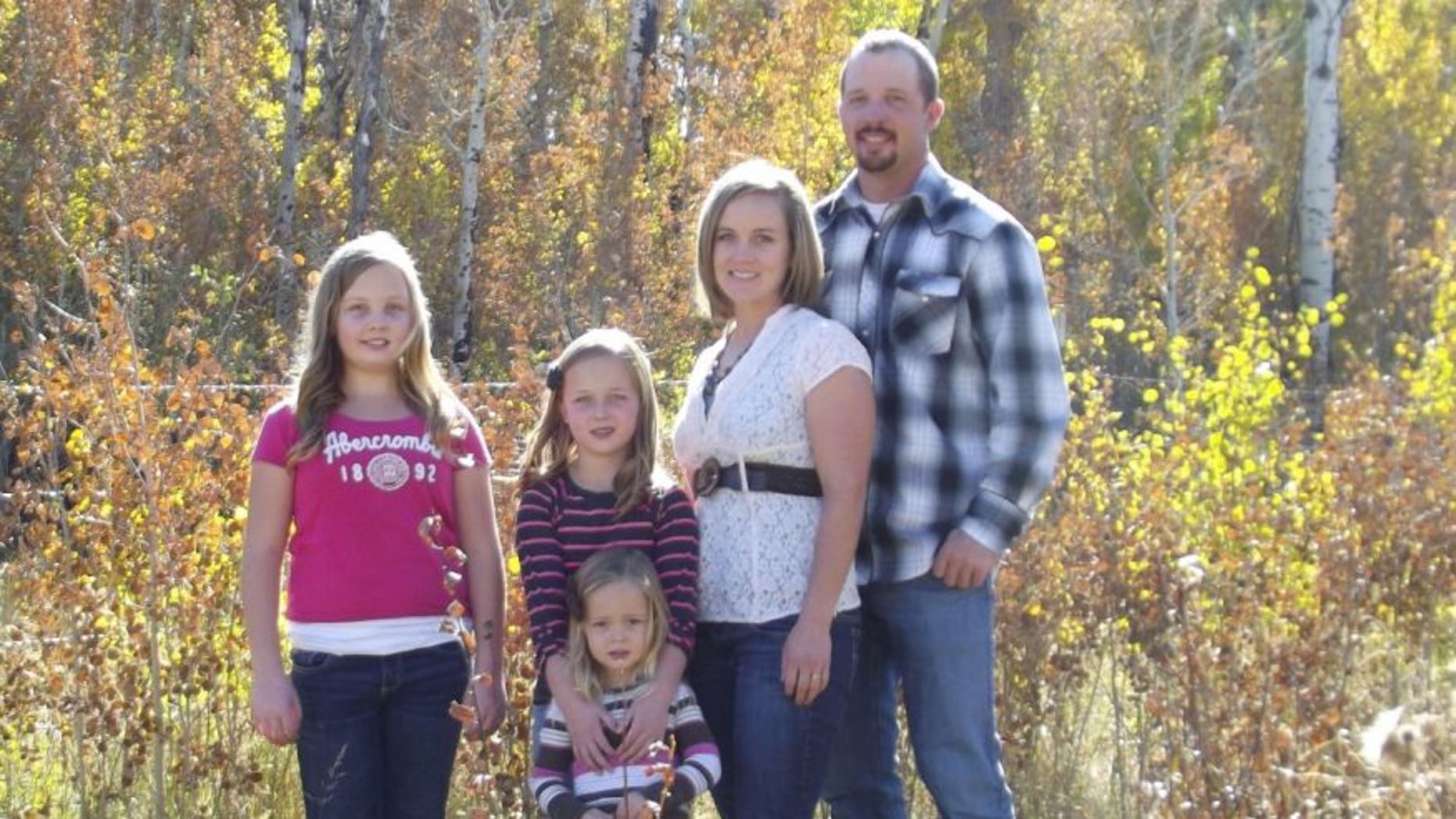 Andy Johnson, of Fort Bridger, Wy., is pictured in an undated photo with his wife and daughters.