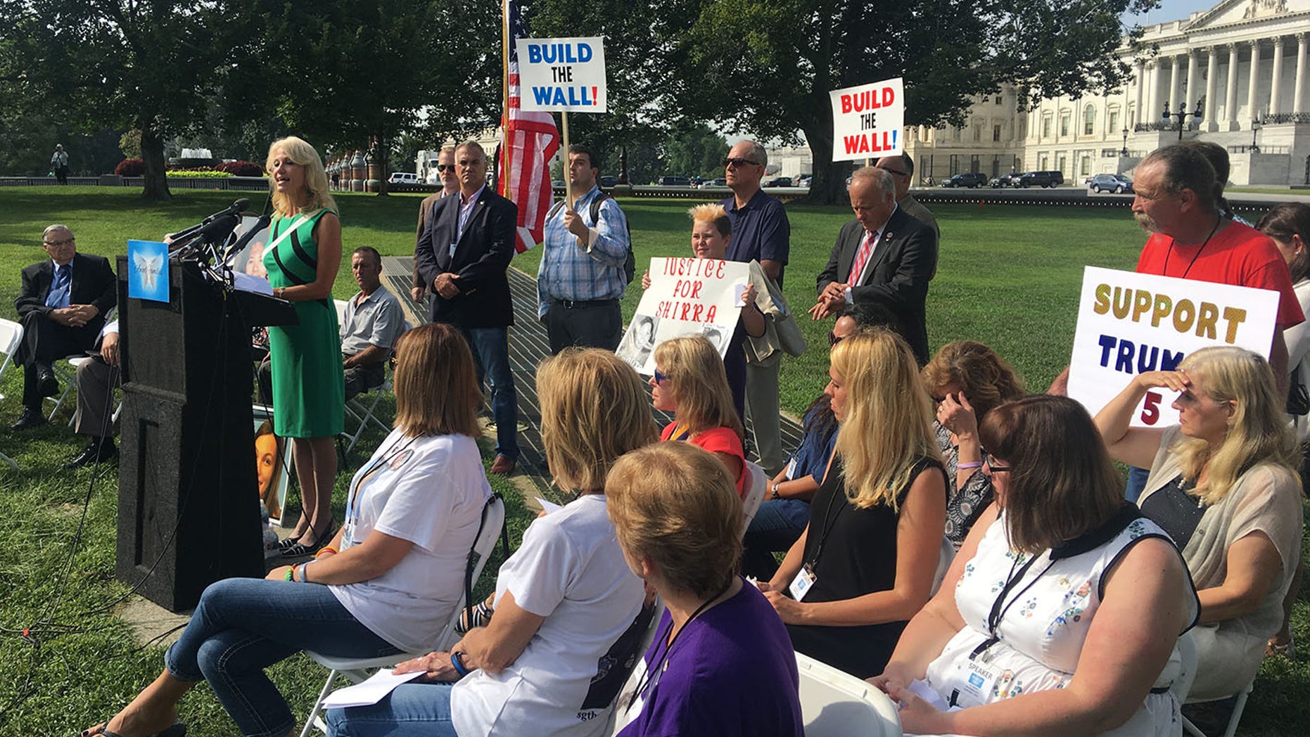 White House counselor Kellyanne Conway speaks on illegal immigrant crime Friday outside the Capitol with "Angel Families."
