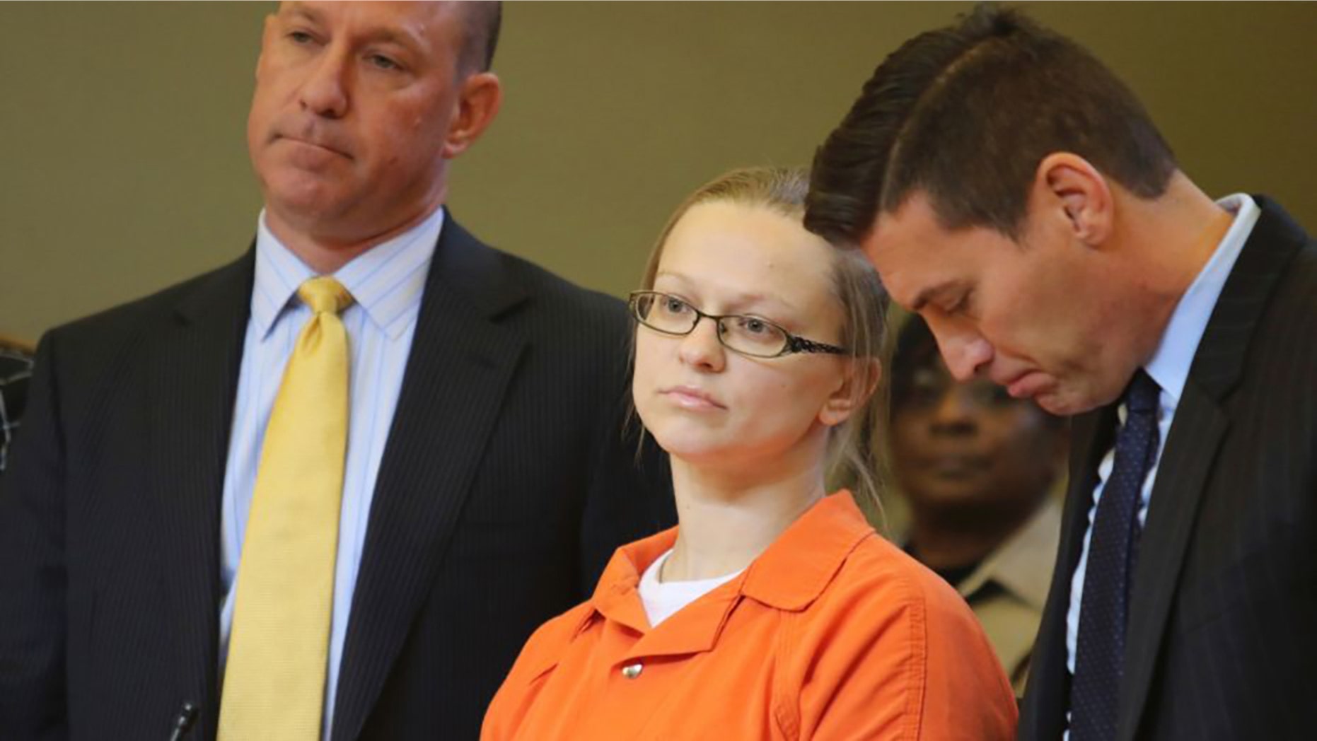 Angelika Graswald standing in court with her attorneys Jeffrey Chartier, left, and Richard Portale, right.