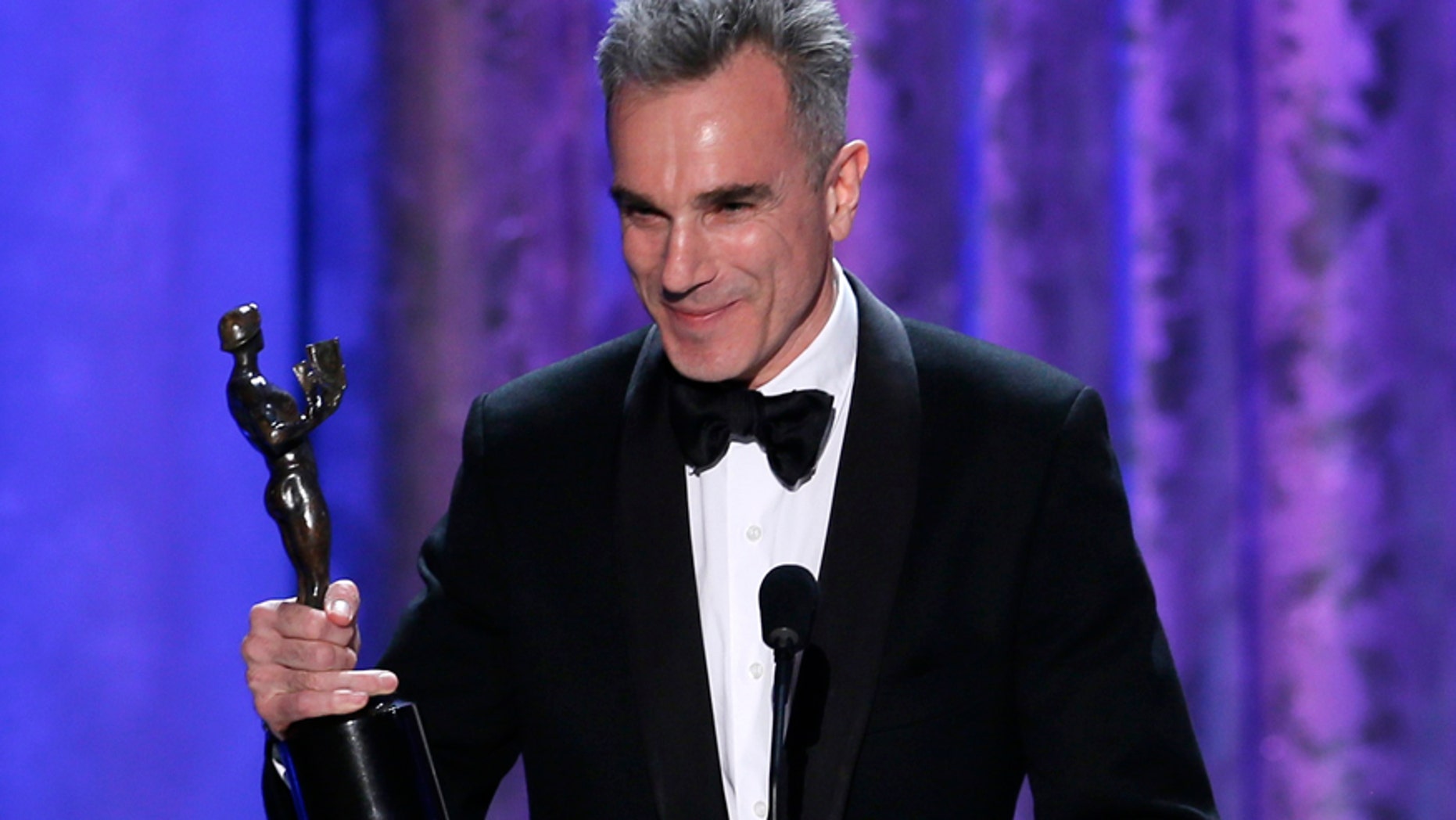 Daniel Day-Lewis accepts the award for outstanding male actor in a leading role for "Lincoln" at the 19th annual Screen Actors Guild Awards in Los Angeles, California January 27, 2013.