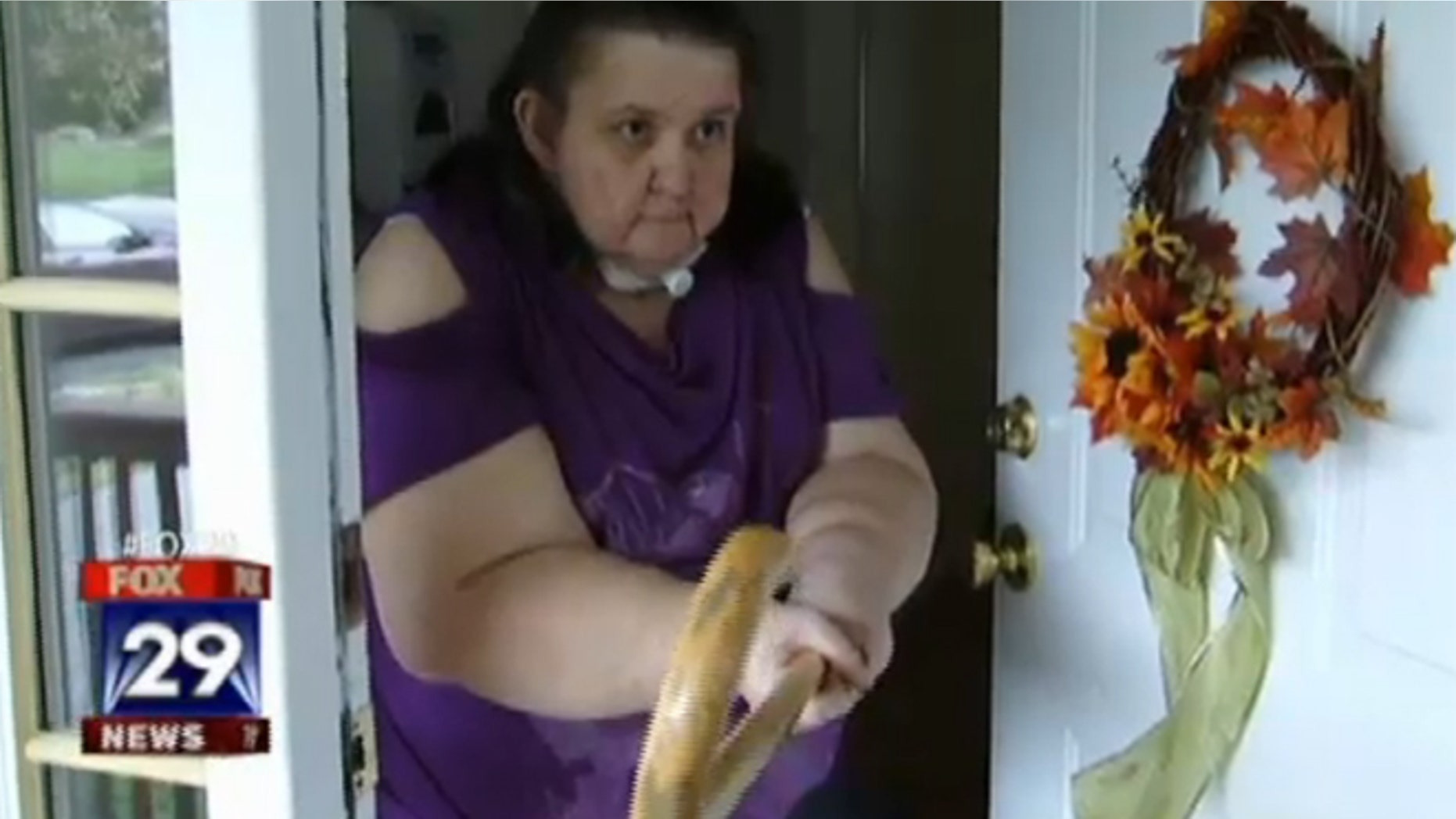 In this photo, Anita shows how she swung at the would-be robber.