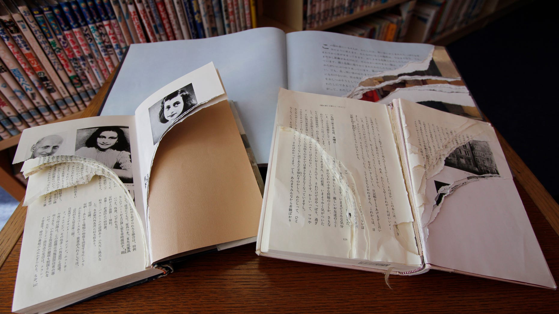 Feb. 21, 2014. Ripped copies of Anne Frank's 'Diary of a Young Girl' and related books are shown at Shinjuku City Library in Tokyo.
