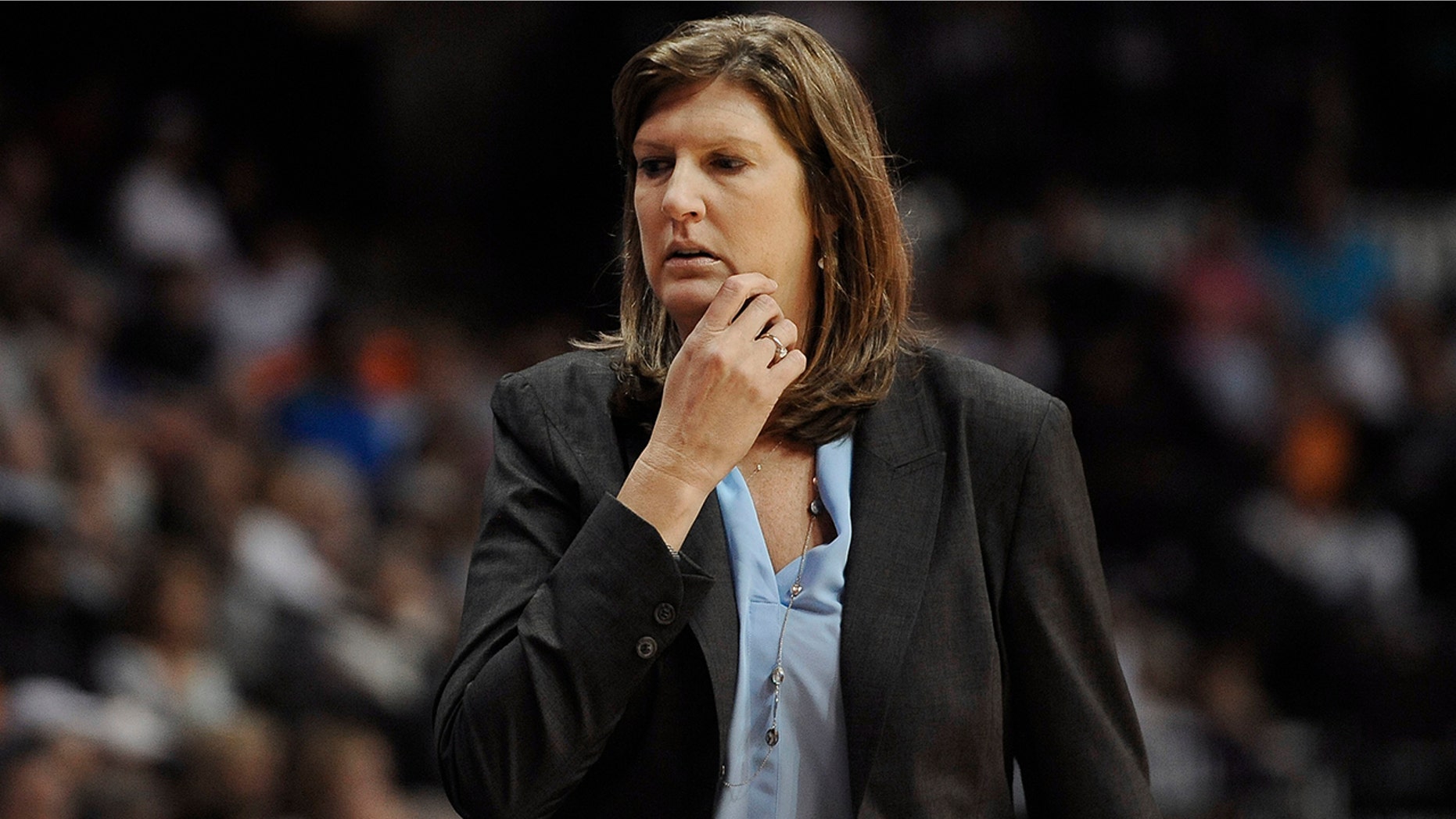 In this July 31, 2015, file photo. Connecticut Sun coach Anne Donovan watches her players in a WNBA basketball game against the Seattle Storm in Uncasville, Conn.