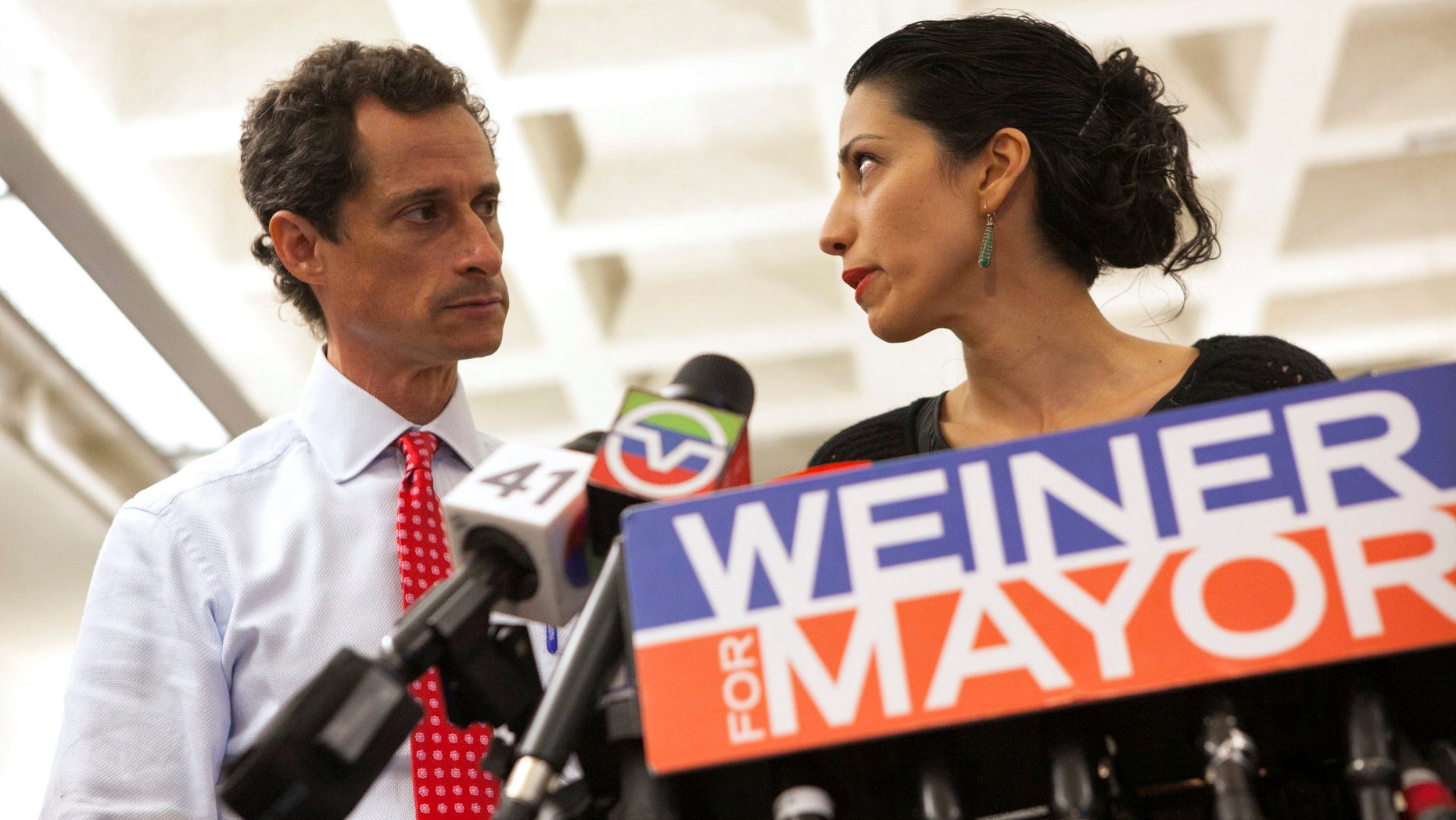 FILE - New York mayoral candidate Anthony Weiner and his wife Huma Abedin attend a news conference in New York, July 23, 2013.