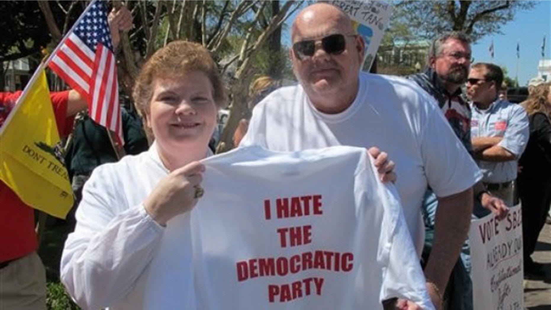 Renee and J.R. Hammond of McCalla distribute t-shirts during a rally by opponents of the federal health care plan on Tuesday, March 30, 2010 in front of the Alabama Statehouse in Montgomery, Ala.(AP)
