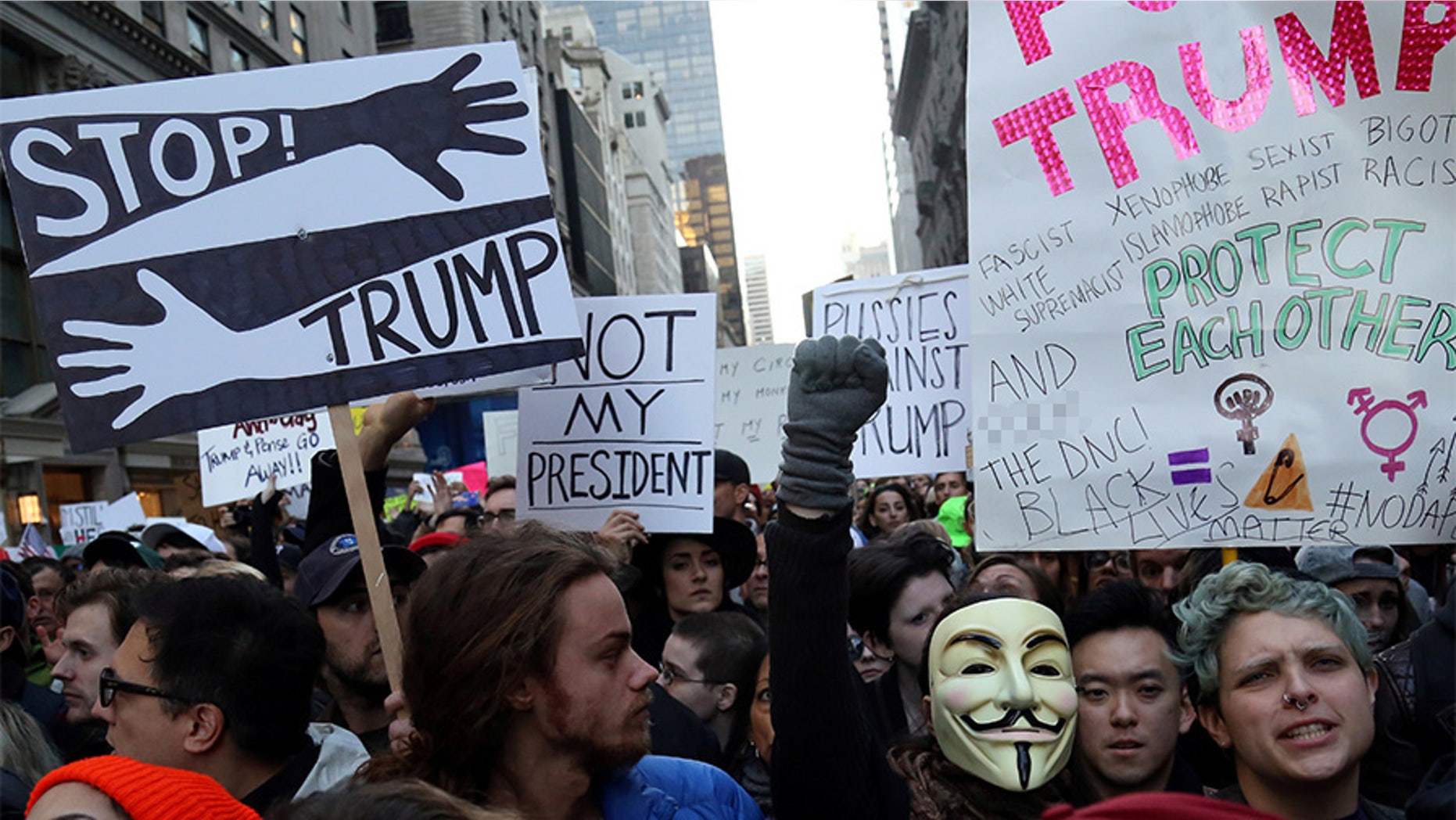 Demonstrators chant slogans during a protest against President-elect Donald Trump in Manhattan, New York, on November 12, 2016.