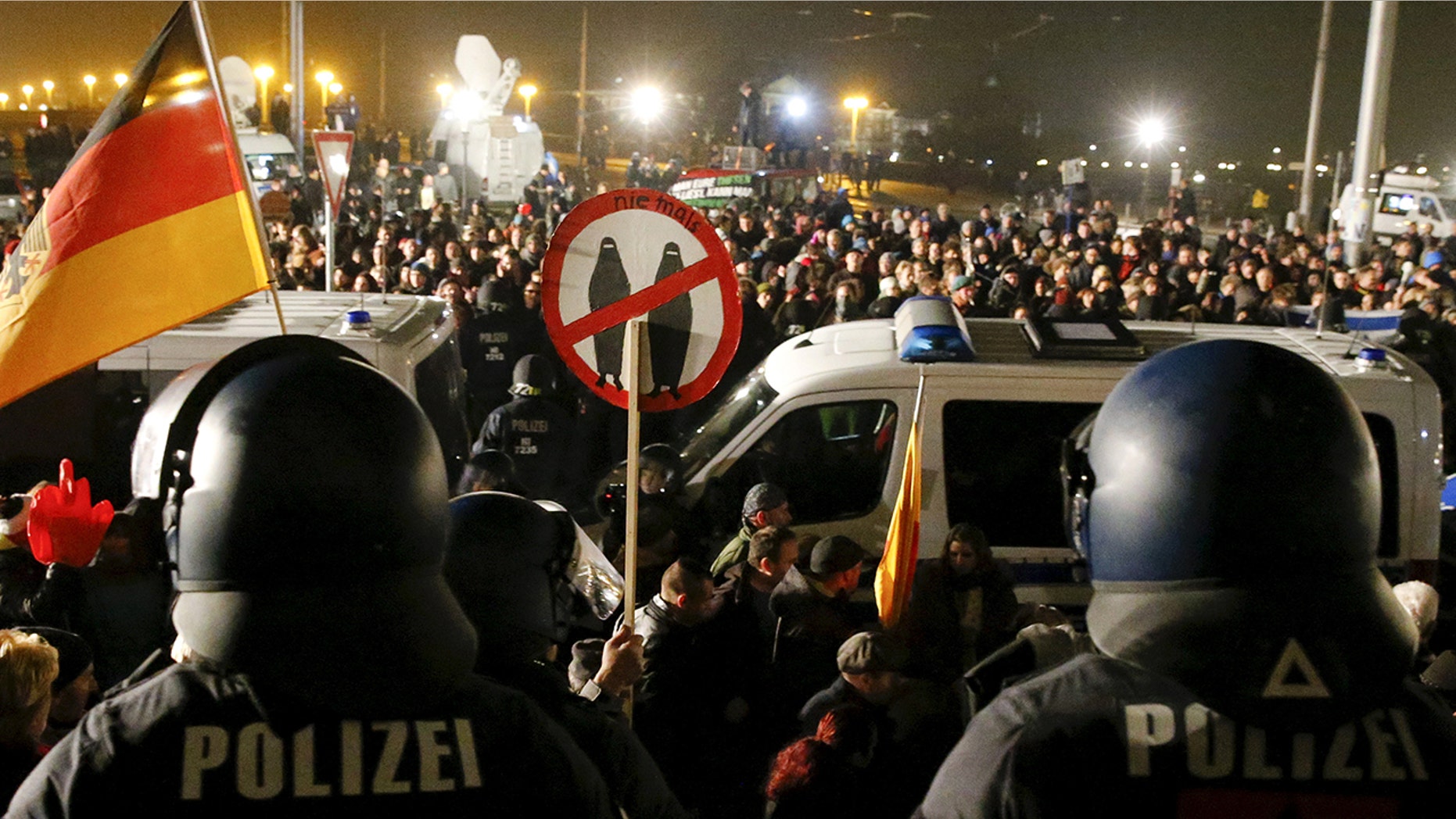 People attend an anti-immigration march organized by the right-wing Patriotic Europeans Against the Islamisation of the West in Dresden, Germany.