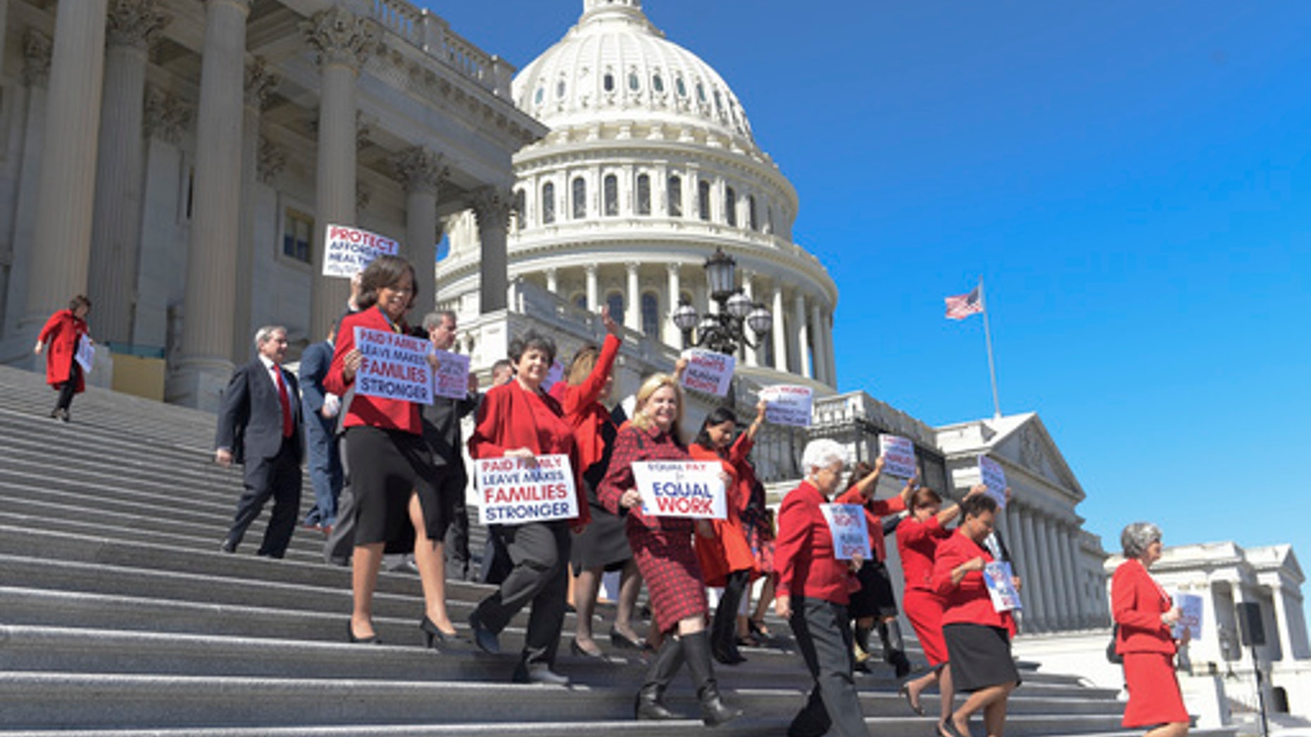 Democratic House members walk down the steps of Capitol Hill in Washington, Wednesday, March 8, 2017, for an event to honor International Women's Day. (AP Photo/Susan Walsh)