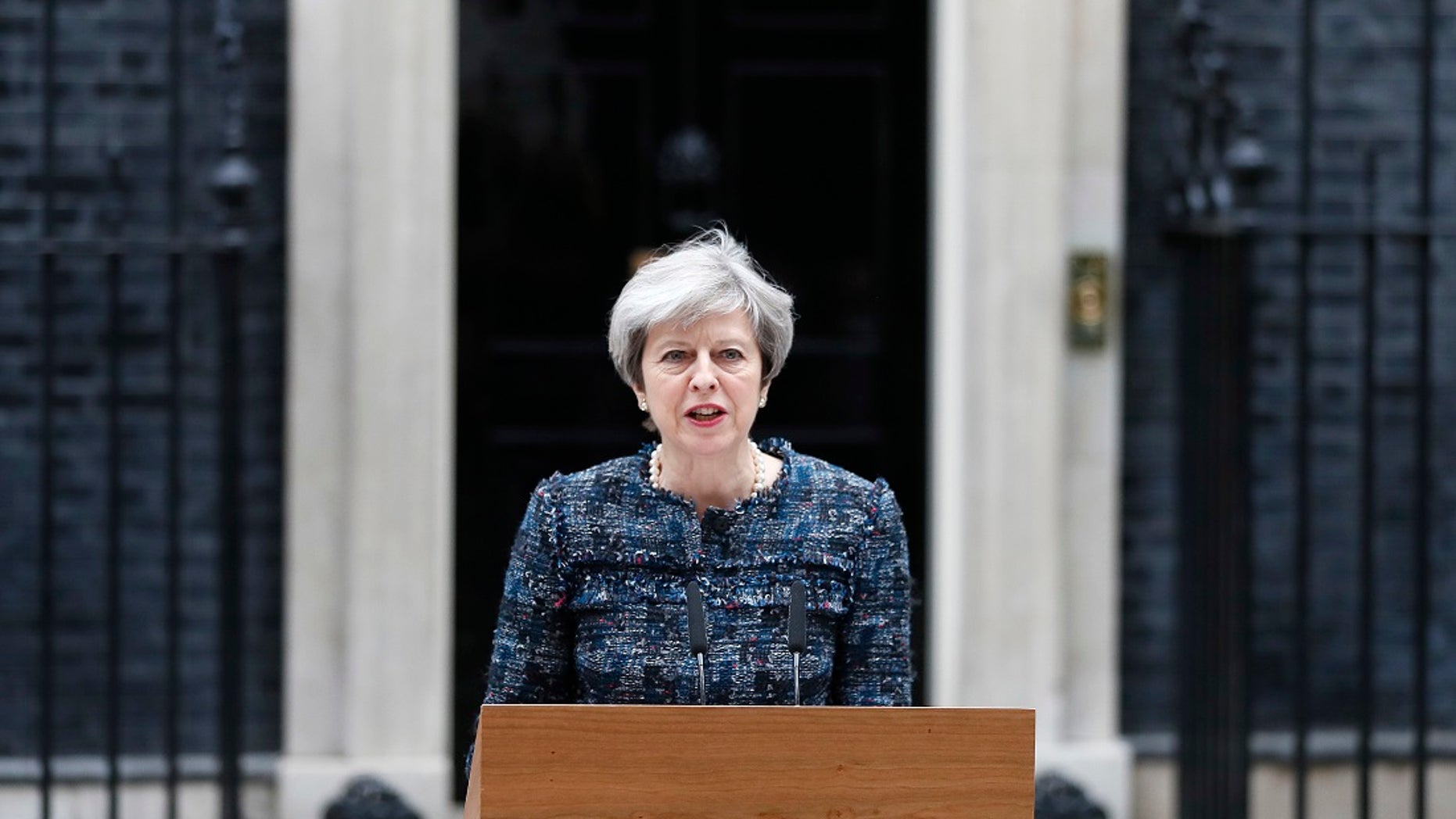 British Prime Minister Theresa May speaks to the media outside 10 Downing Street after returning from visiting Queen Elizabeth II at Buckingham Palace, in London where she asked for the dissolution of Parliament ahead of the upcoming general election, Wednesday, May 3, 2017. (AP Photo/Kirsty Wigglesworth)