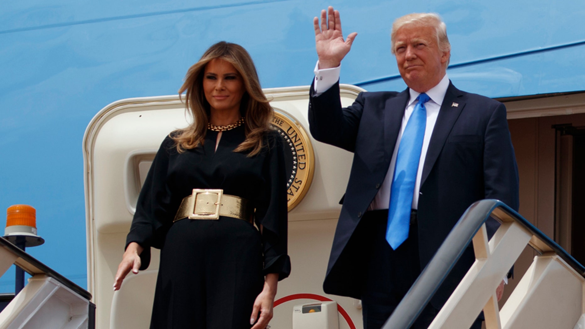 President Donald Trump and first lady Melania arrive for a welcome ceremony at the Royal Terminal of King Khalid International Airport, Saturday, May 20, 2017, in Riyadh. (AP Photo/Evan Vucci)