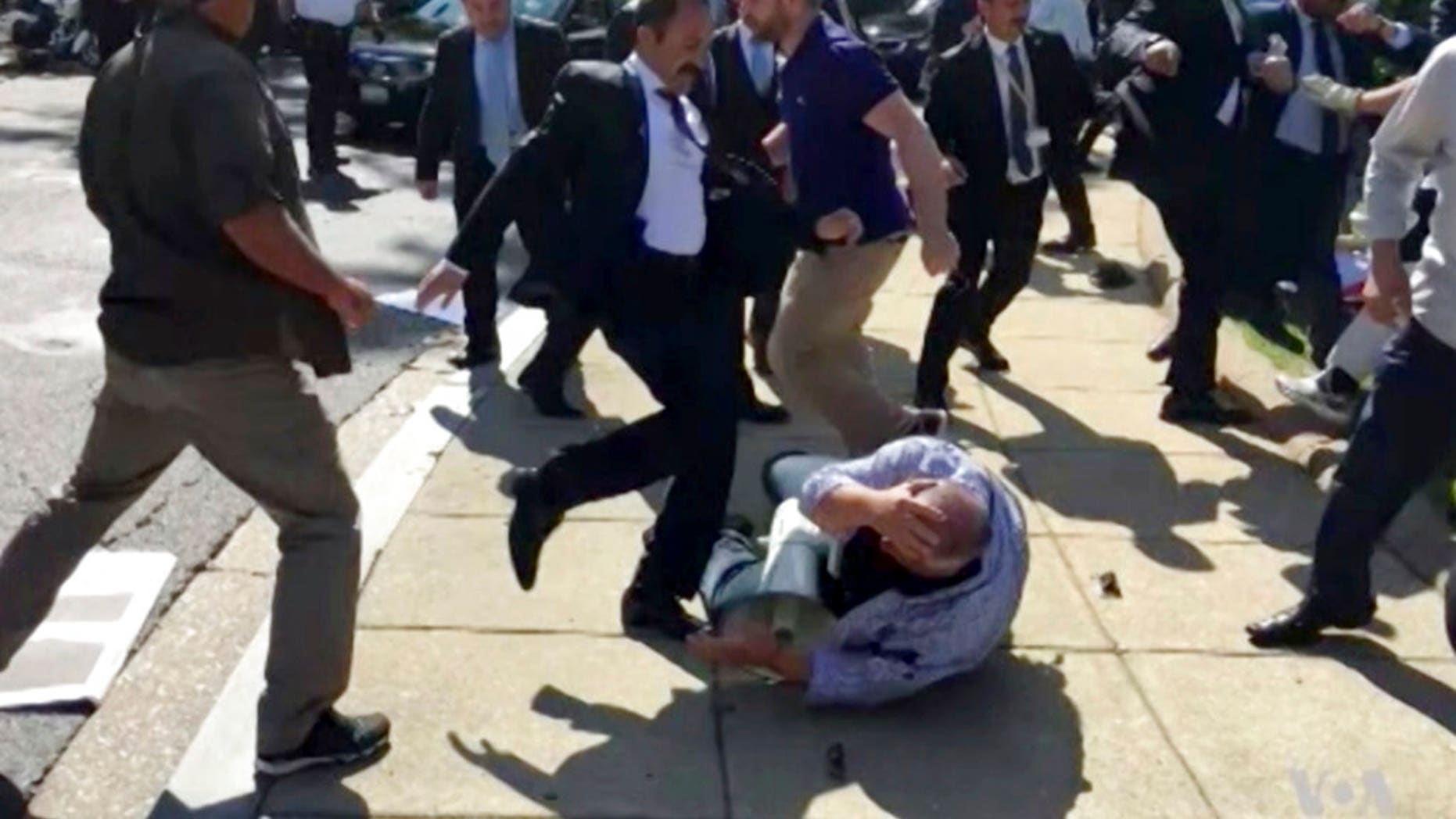 Members of Turkish President Recep Tayyip Erdogan's security detail are shown attacking peaceful protesters during Erdogan's trip to Washington in May.