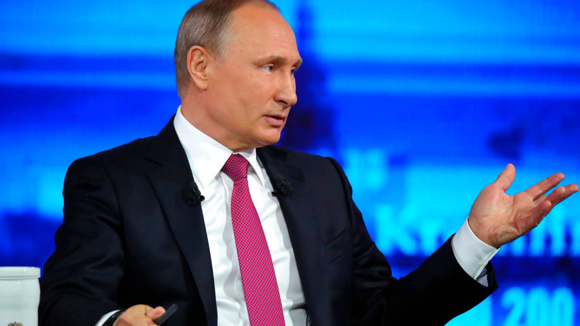 Russian President Vladimir Putin gestures during his annual televised call-in show in Moscow on Thursday, June 15, 2017. President Vladimir Putin has voiced hope for normalizing Russia-U.S. ties. (Mikhail Klimentyev/Sputnik, Kremlin Pool Photo via AP)