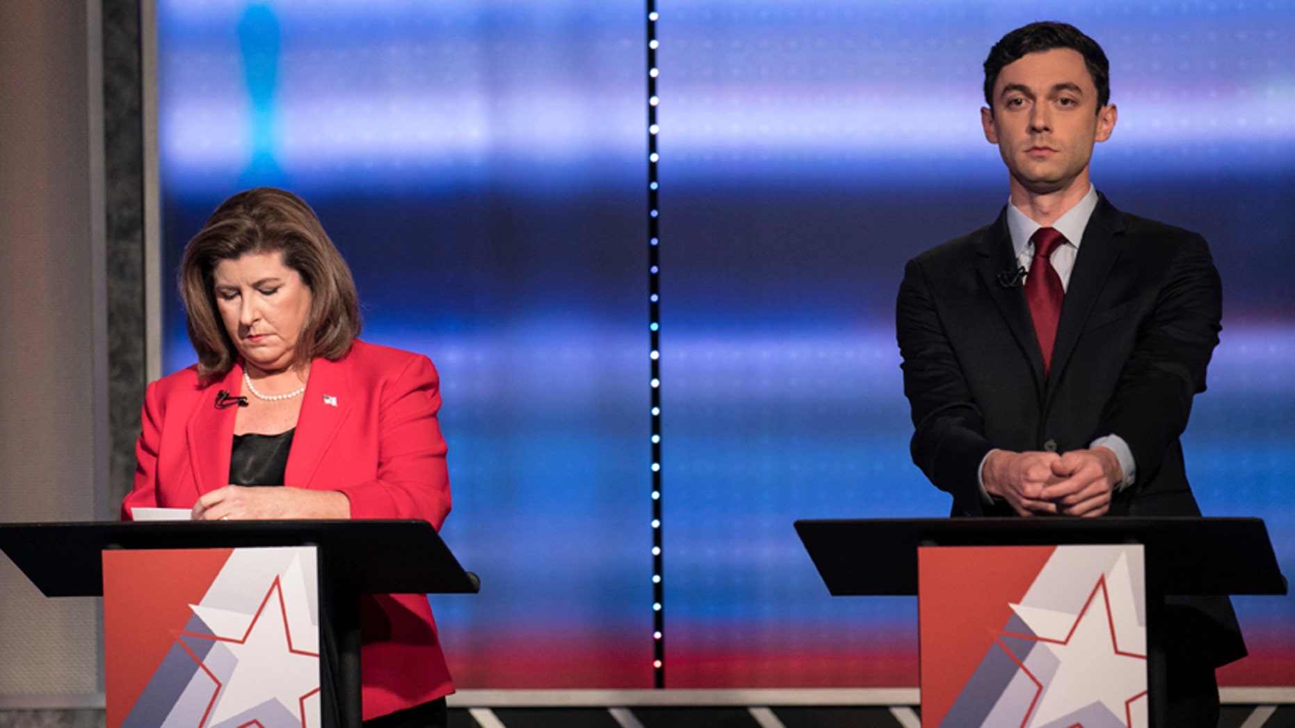 FILE - In this June 6, 2017 file photo, candidates in Georgia's 6th Congressional District race Republican Karen Handel, left, and Democrat Jon Ossoff prepare to debate in Atlanta. Handel and Ossoff are making their last push this weekend before voters in Georgias 6th Congressional District cast ballots Tuesday, June 20, to replace Tom Price in Washington, a contest seen as an early political test for the Trump administration.
(Branden Camp/Atlanta Journal-Constitution via AP)
