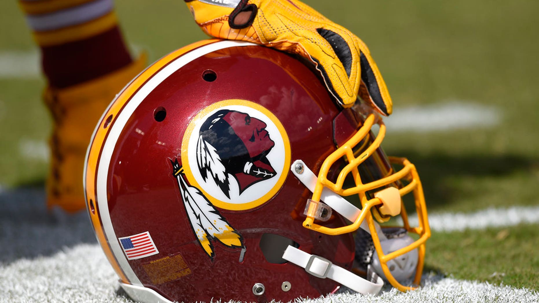 A Washington Redskins helmet on the sidelines.