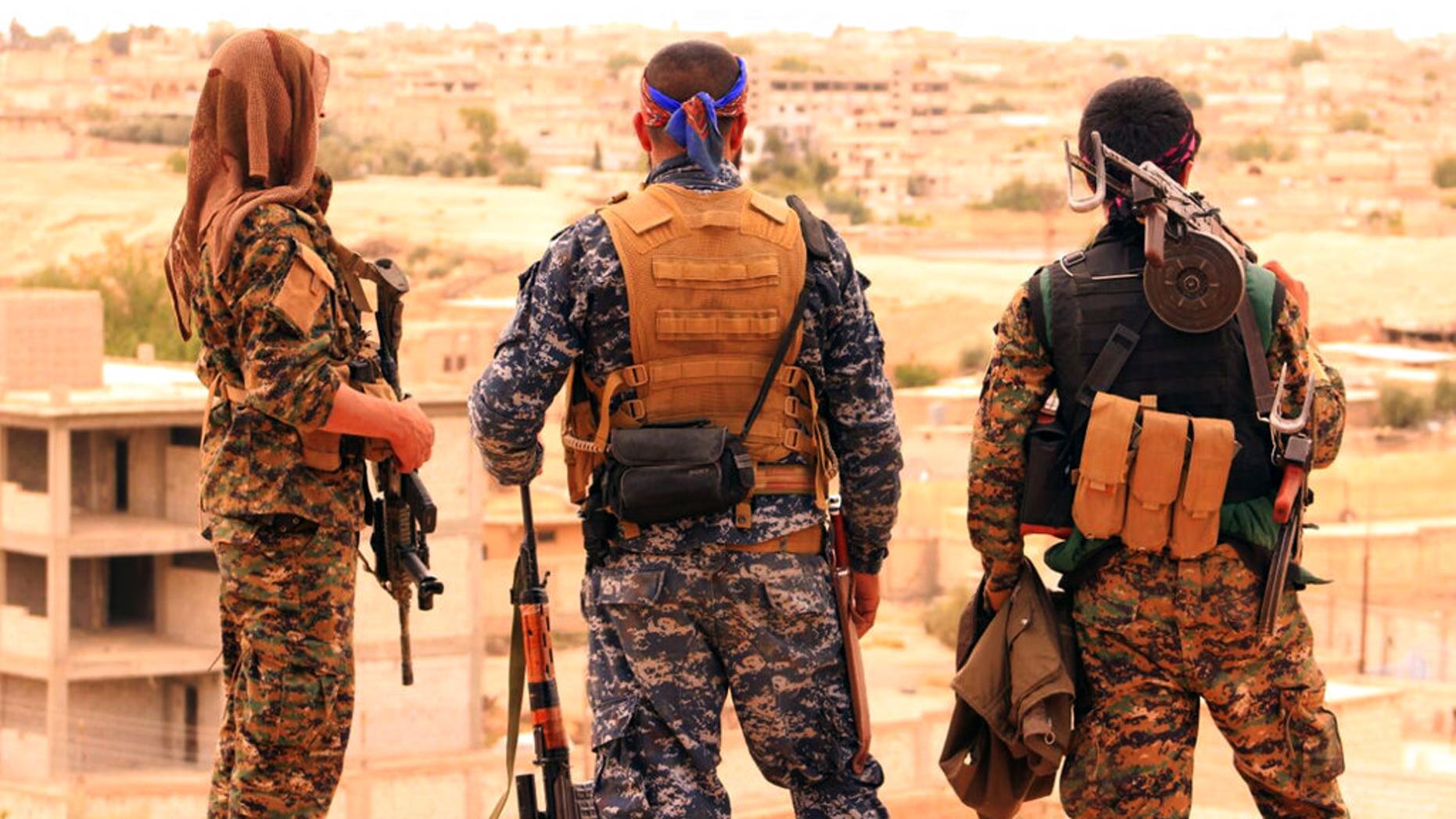 Syrian Democratic Forces looking toward the northern town of Tabqa, Syria.
