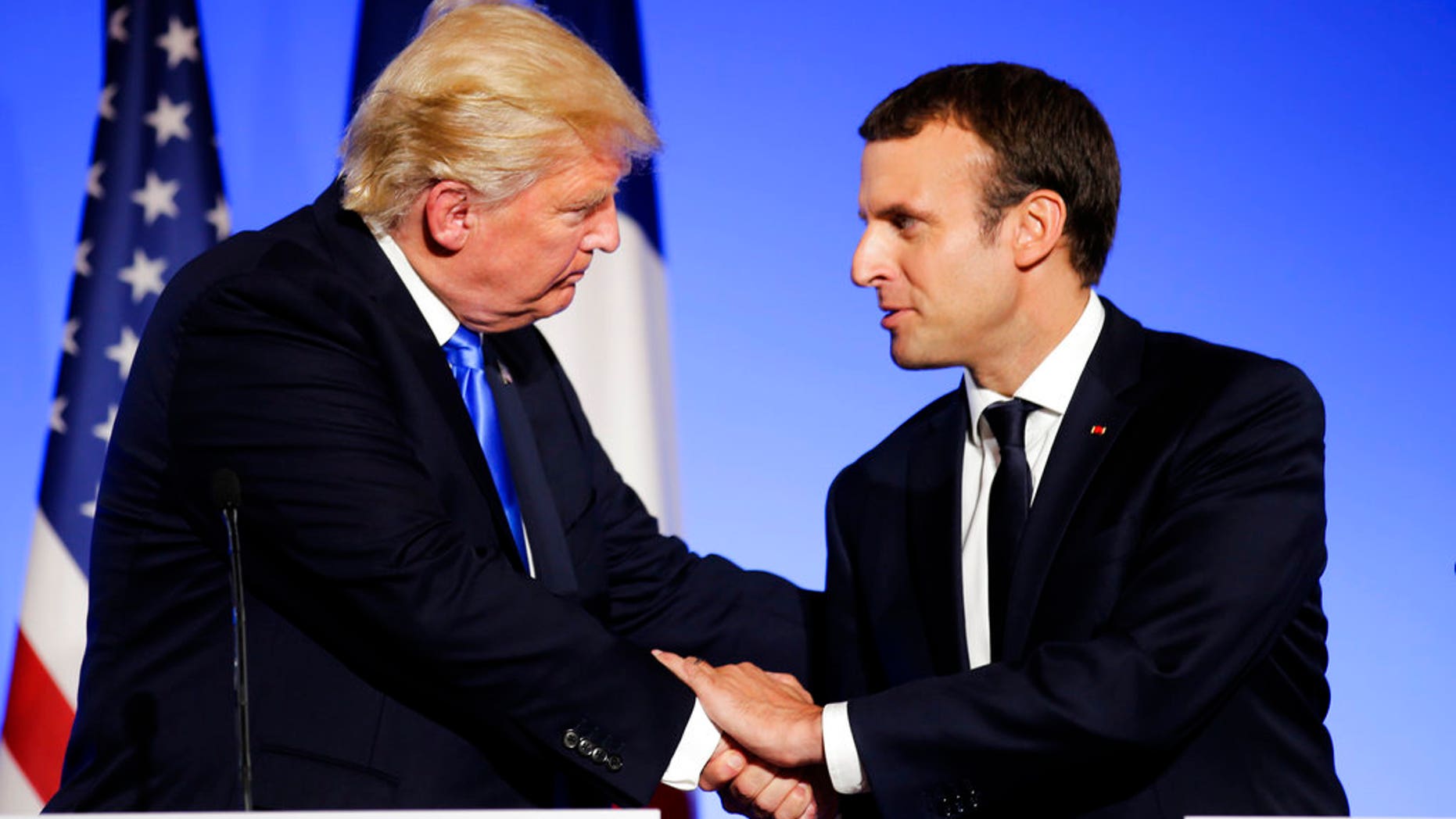French President Macron says he may have changed President Trump's mind on the topic of climate change.