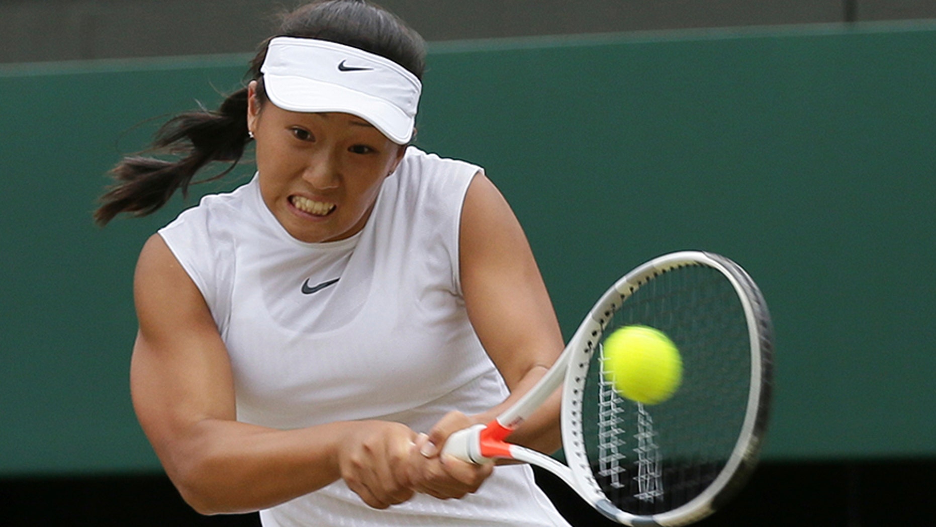 Claire Liu of the United States returns to compatriot Ann Li in the Girls' Singles final match on day twelve at the Wimbledon Tennis Championships in London Saturday, July 15, 2017. (AP Photo/Tim Ireland)