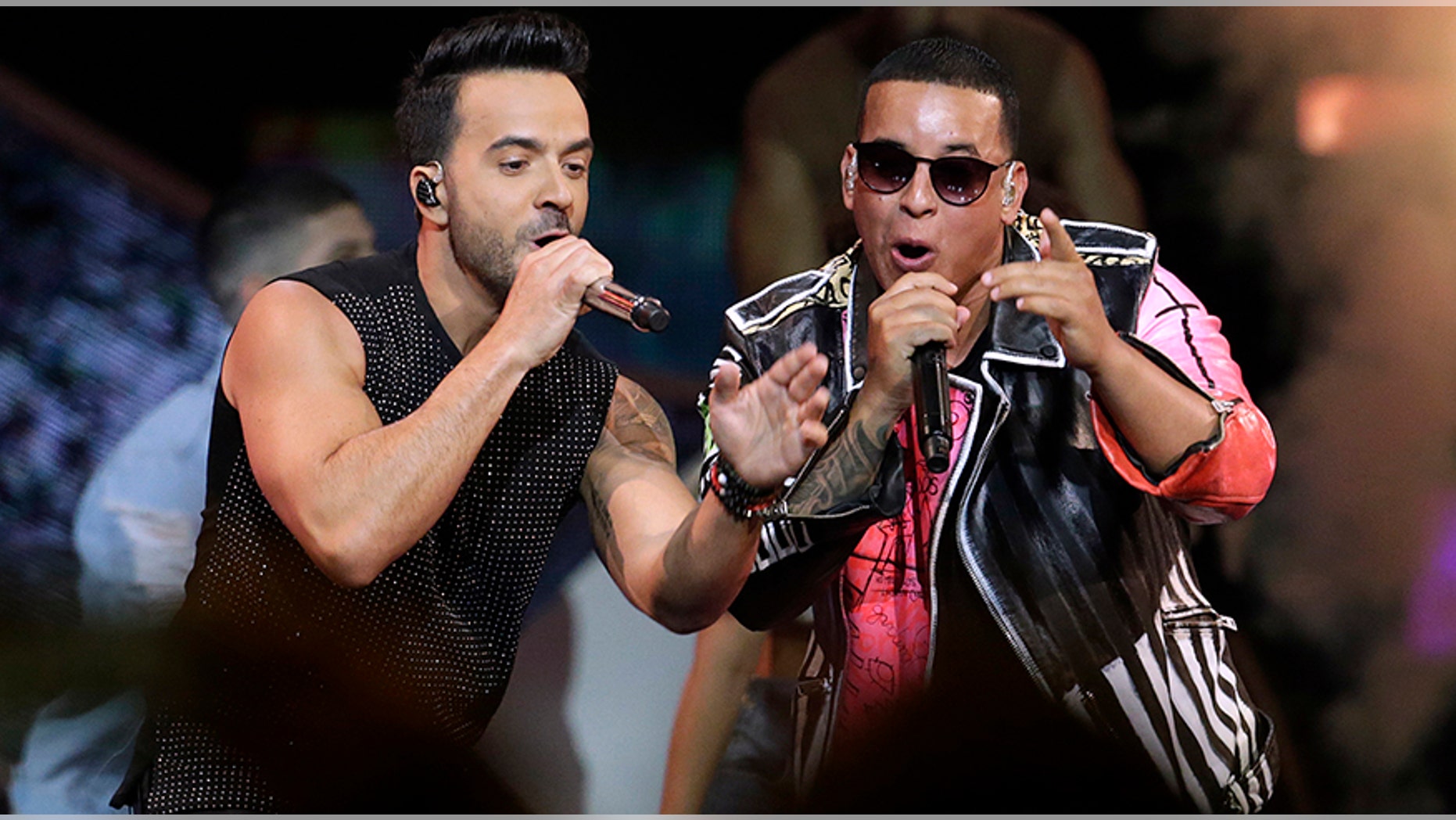 FILE - In this April 27, 2017 file photo, singers Luis Fonsi, left and Daddy Yankee perform during the Latin Billboard Awards in Coral Gables, Fla. On Friday, Aug. 4, 2017, YouTube announced that the music video for the No. 1 hit song âDespacitoâ has become the most viewed clip on YouTube of all-time. (AP Photo/Lynne Sladky, File)