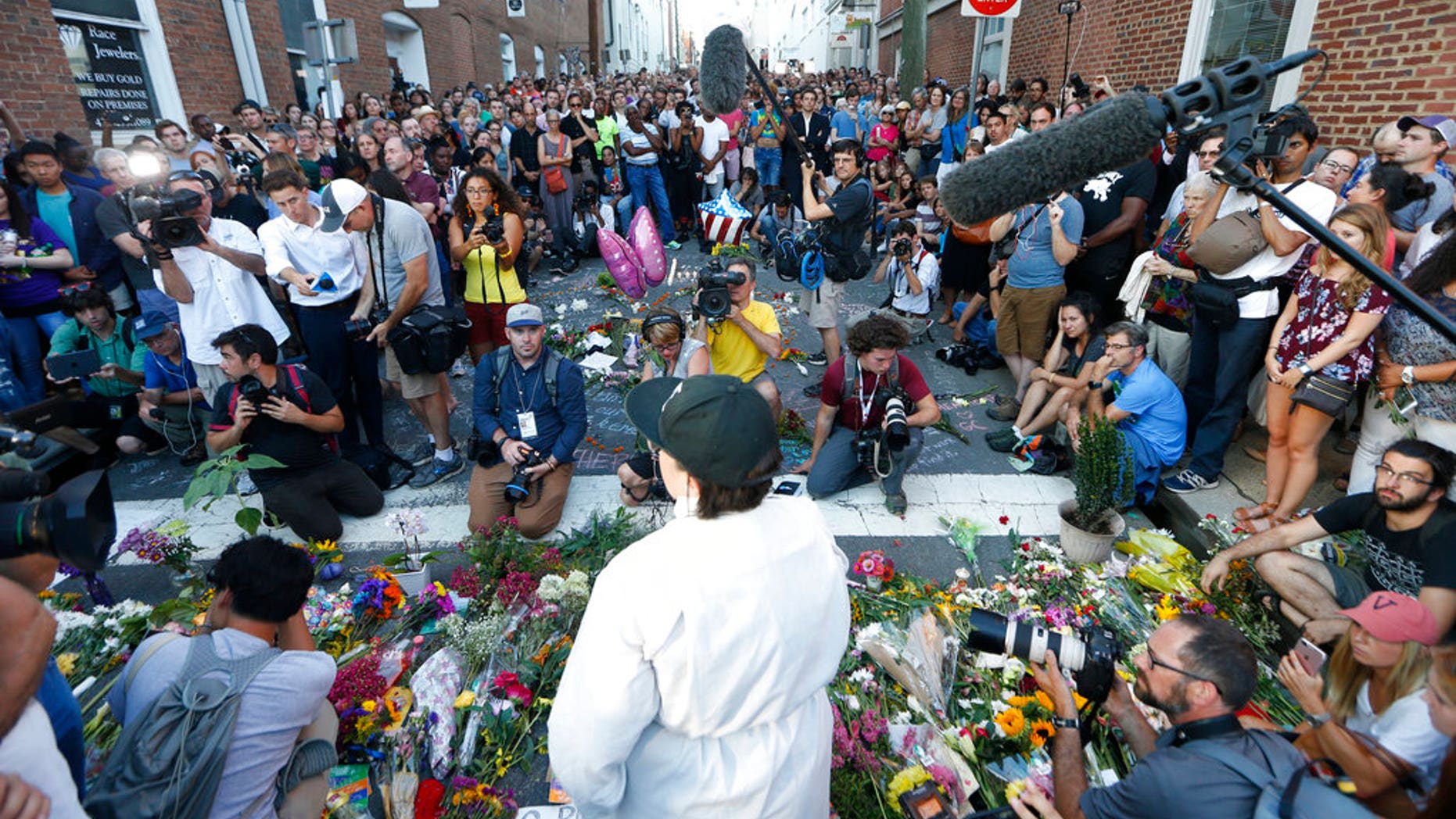 A vigil was held in Charlottesville, Va., one day after a car rammed into a crowd of people, killing one and leaving 19 injured.