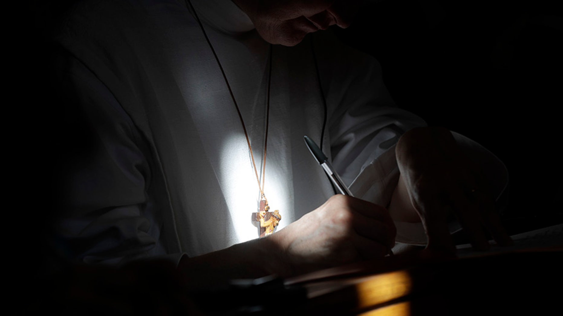 A nun takes notes as she attends a conference on the Latin Mass at Pontifical University of St. Thomas Aquinas in Rome, Thursday, Sept. 14, 2017. (AP Photo/Gregorio Borgia)
