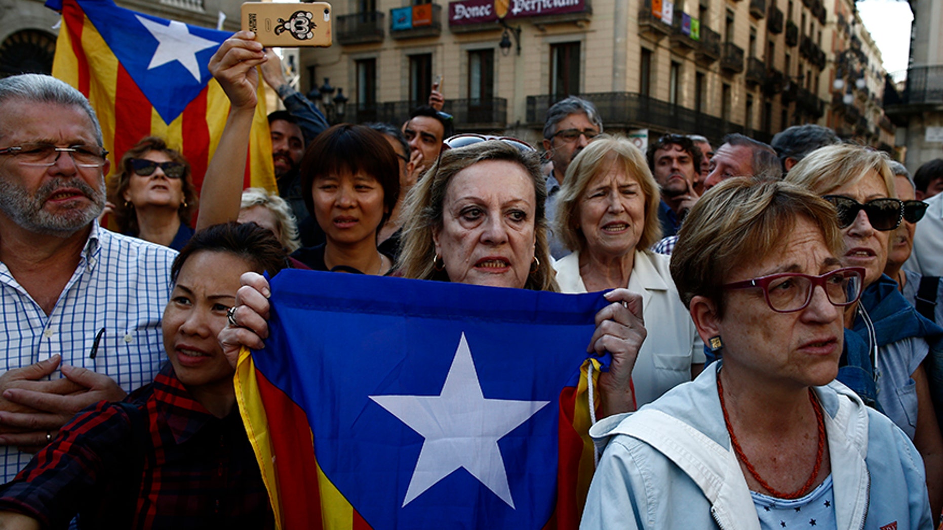 Pro-secession Catalan groups are calling for protests as the Spanish government moves to take control of the region's semi-autonomous powers.