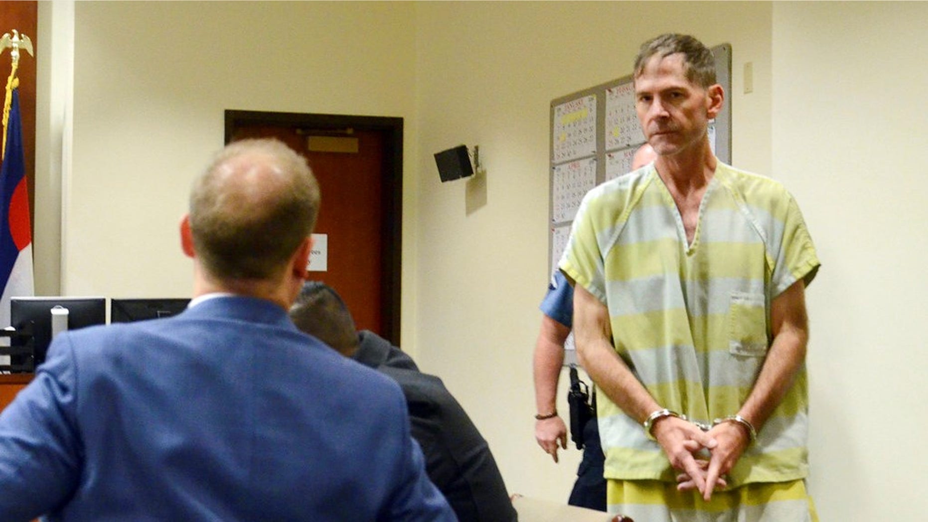 Scott Ostrem, 47, suspected of fatally shooting three people inside a suburban Denver Walmart, enters a courtroom in Brighton, Colo. on Monday.