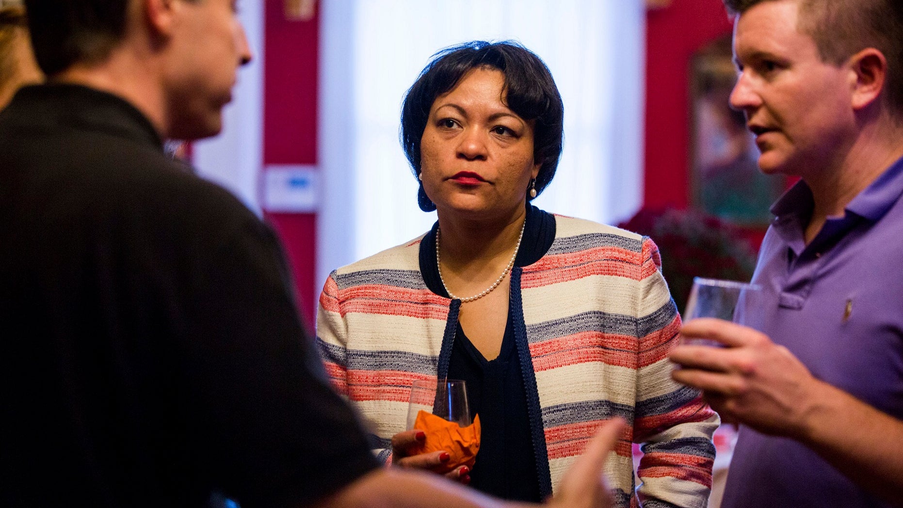 Democrat LaToya Cantrell, center, listens to campaign donors, Sept. 22, 2017.