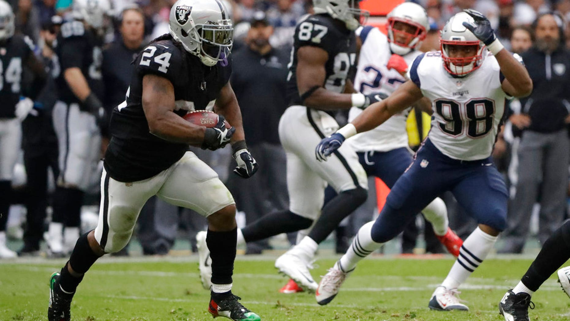 Oakland Raider Marshawn Lynch (24) protested the U.S. national anthem Sunday at a game in Mexico City by sitting during The Star-Spangled Banner and standing during the Mexican national anthem.