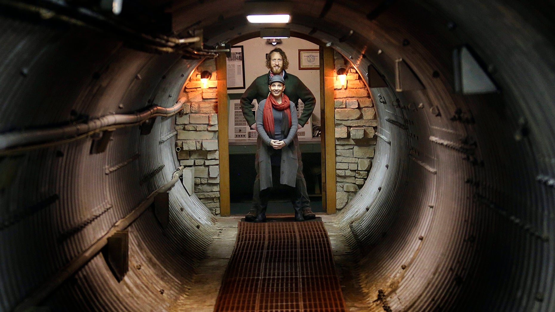 In this Nov. 2, 2017 photo, Matthew Fulkerson and his wife Leigh Ann pose at their Subterra Airbnb located in a former underground missile silo base near Eskridge, Kan. The Subterra Castle Airbnb opened for business about six months ago.
