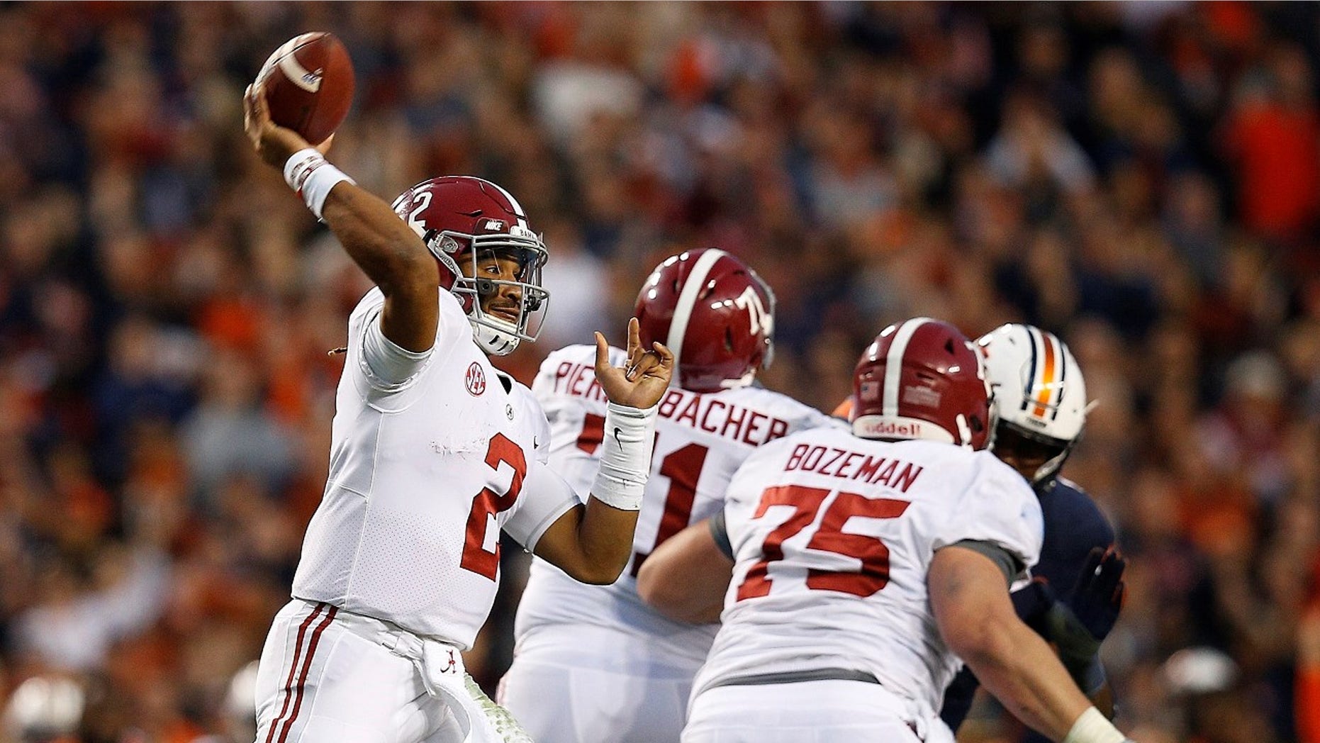Alabama quarterback Jalen Hurts throws the ball during the second half of the Iron Bowl NCAA college football game, in Auburn, Ala.
