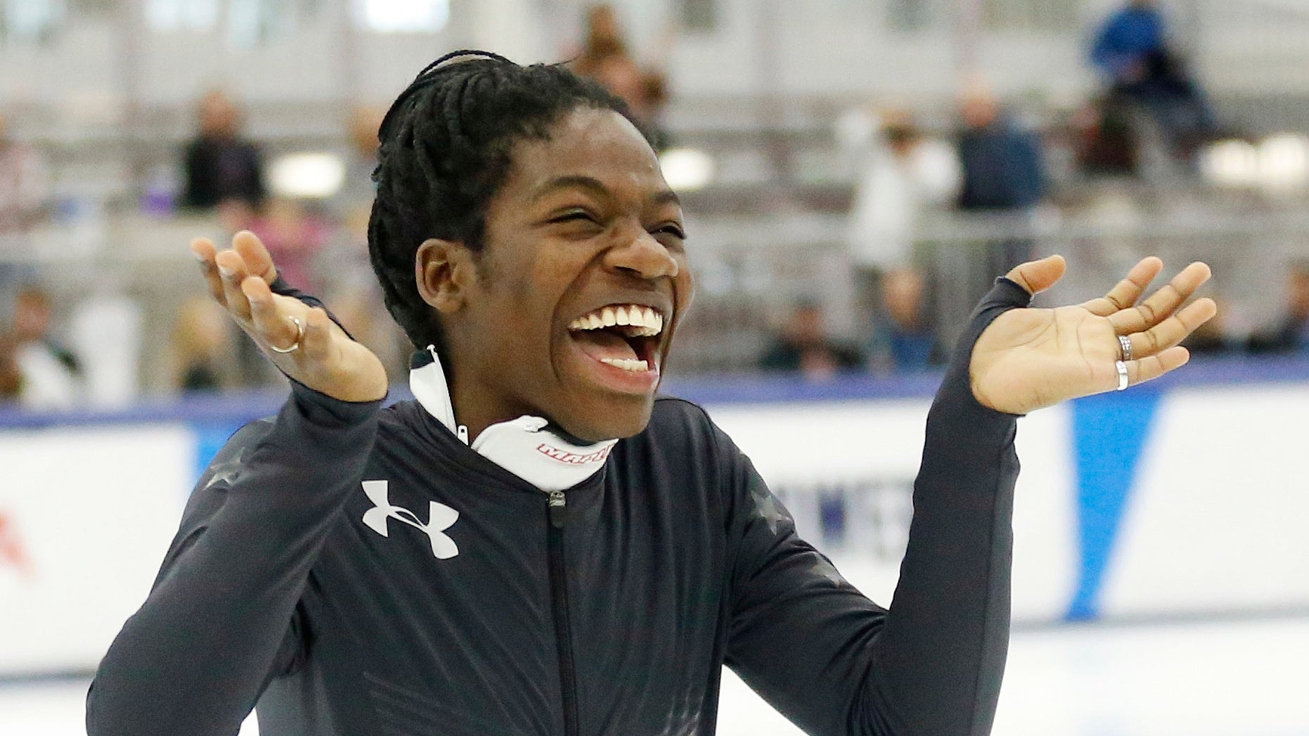 Maame Biney reacts during a medal ceremony after winning women's 500-meter A final race during the U.S. Olympic short track speedskating trials Saturday, Dec. 16, 2017, in Kearns, Utah. (AP Photo/Rick Bowmer)