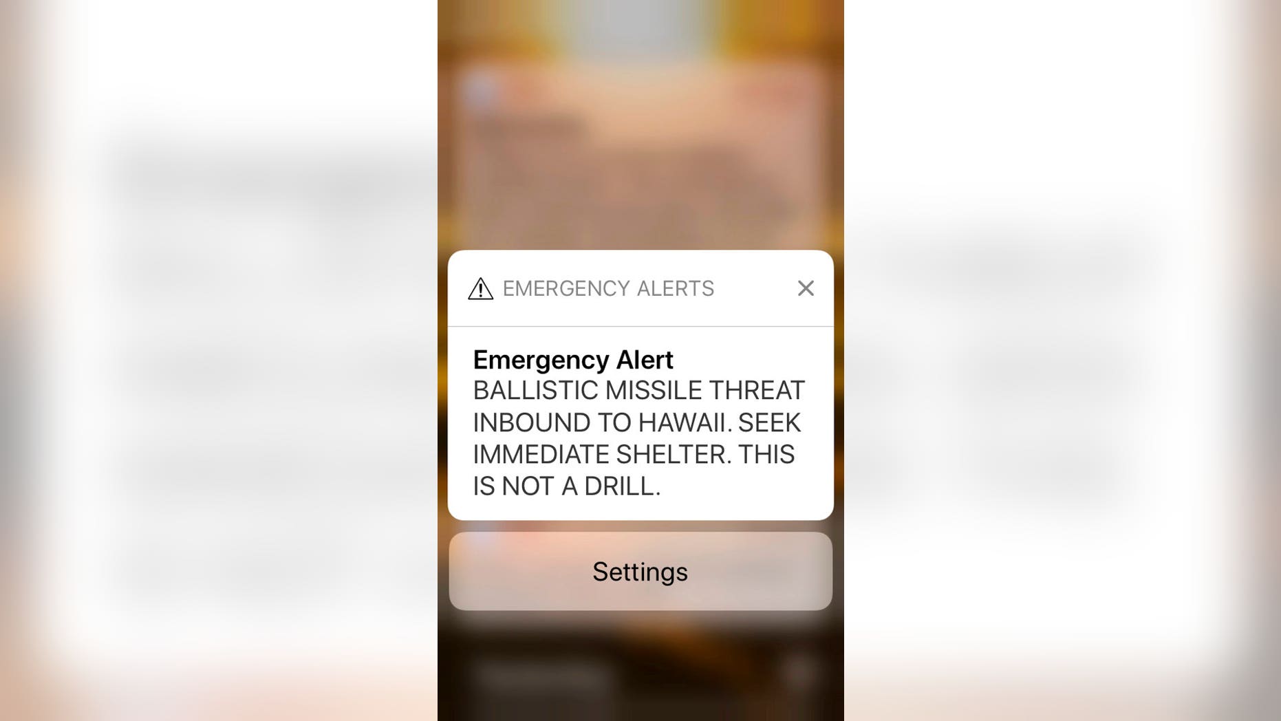 This smartphone screen capture shows a false incoming ballistic missile emergency alert sent from the Hawaii Emergency Management Agency system on Saturday, Jan. 13, 2018. (AP Photo/Caleb Jones)