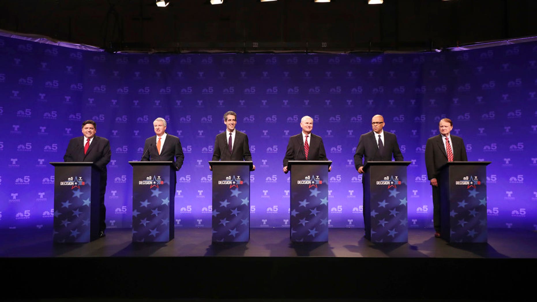 Illinois gubernatorial candidate Bob Daiber, third from the right, settled a retaliation lawsuit at taxpayer expense, a newspaper reported.