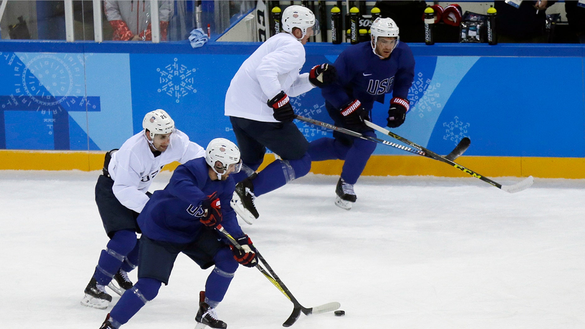 United State's Ryan Gunderson battles controls the puck against Mark Arcobello, left, during practice ahead of the 2018 Winter Olympics in Gangneung, South Korea, Friday, Feb. 9, 2018. (AP Photo/Kiichiro Sato)