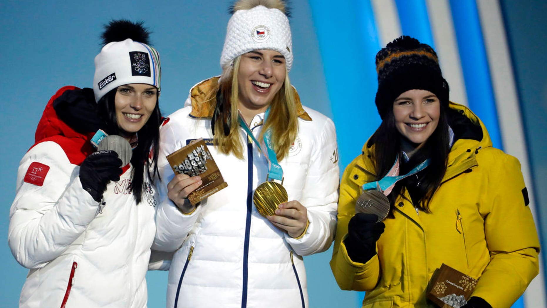 Medalists in the women's super-G, from left: Austria's Anna Veith, silver; Czech Republic's Ester Ledecka, gold; and Liechtenstein's Tina Weirather, bronze, are seen at the 2018 Winter Olympics in South Korea, Feb. 17, 2018.
