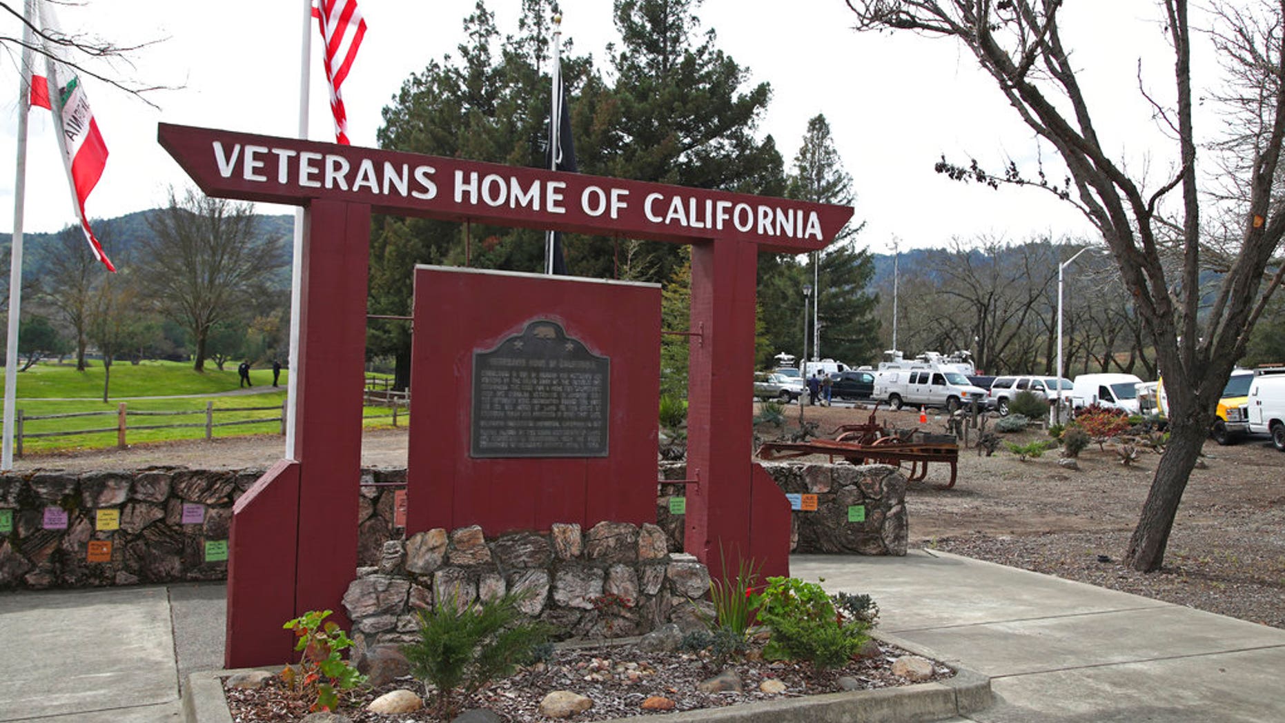 News trucks are seen near the entrance to the Veterans Home of California in Yountville, Calif., March 9, 2018.