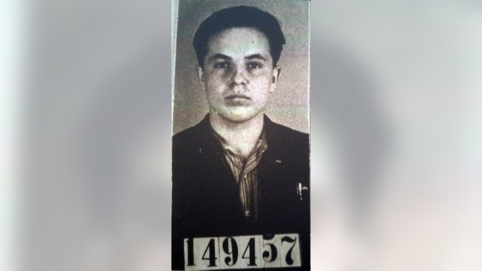 FILE - This Undated file photo of Michael Karkoc was part of his application for German citizenship filed with the Nazi SS-run immigration office on Feb. 14, 1940. Polish prosecutors say American authorities are moving ahead with their request to extradite a 99-year-old Minnesota man to be tried on allegations he was involved in a World War II massacre of civilians. (AP Photo/U.S. National Archives, File)