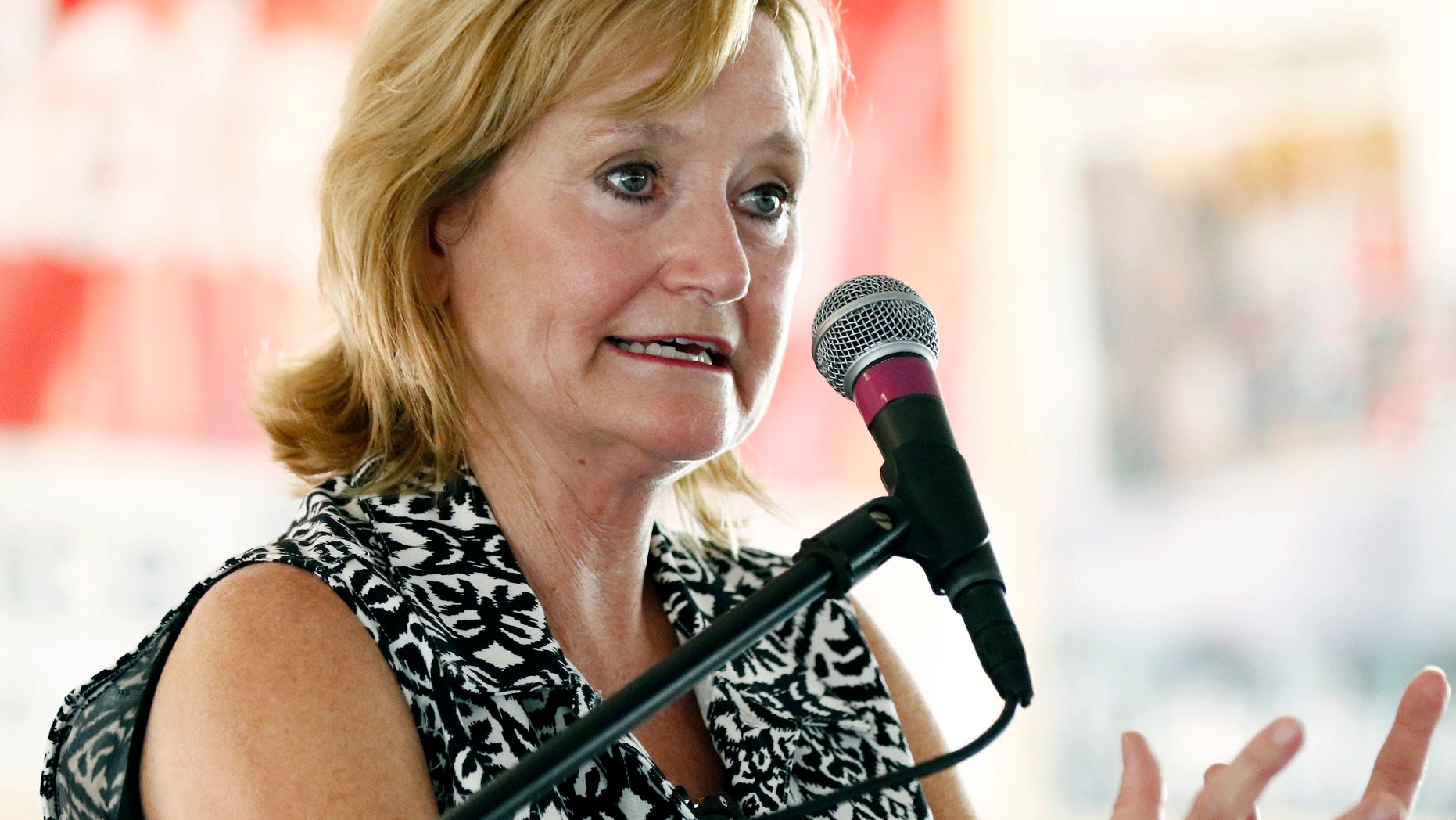 In this July 27, 2017, file photo Mississippi Commissioner of Agriculture and Commerce Cindy Hyde-Smith speaks at the Neshoba County Fair in Philadelphia, Miss.