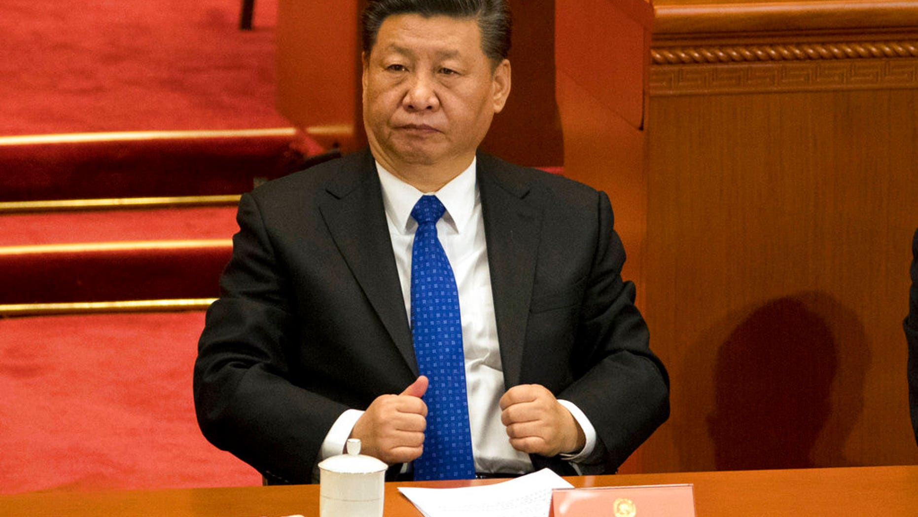 Chinese President Xi Jinping attends the opening session of the Chinese People's Political Consultative Conference in Beijing's Great Hall of the People.