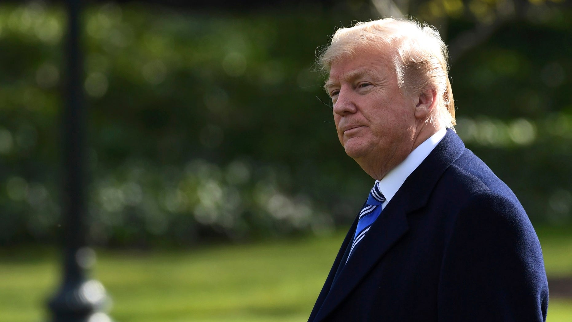 President Donald Trump walks across the South Lawn of the White House in Washington, Friday, March 23, 2018, as he heads to Marine One for a short trip to Andrews Air Force Base. Trump is heading to Florida where he will spend the weekend at the Mar-a-Lago estate. (AP Photo/Susan Walsh)